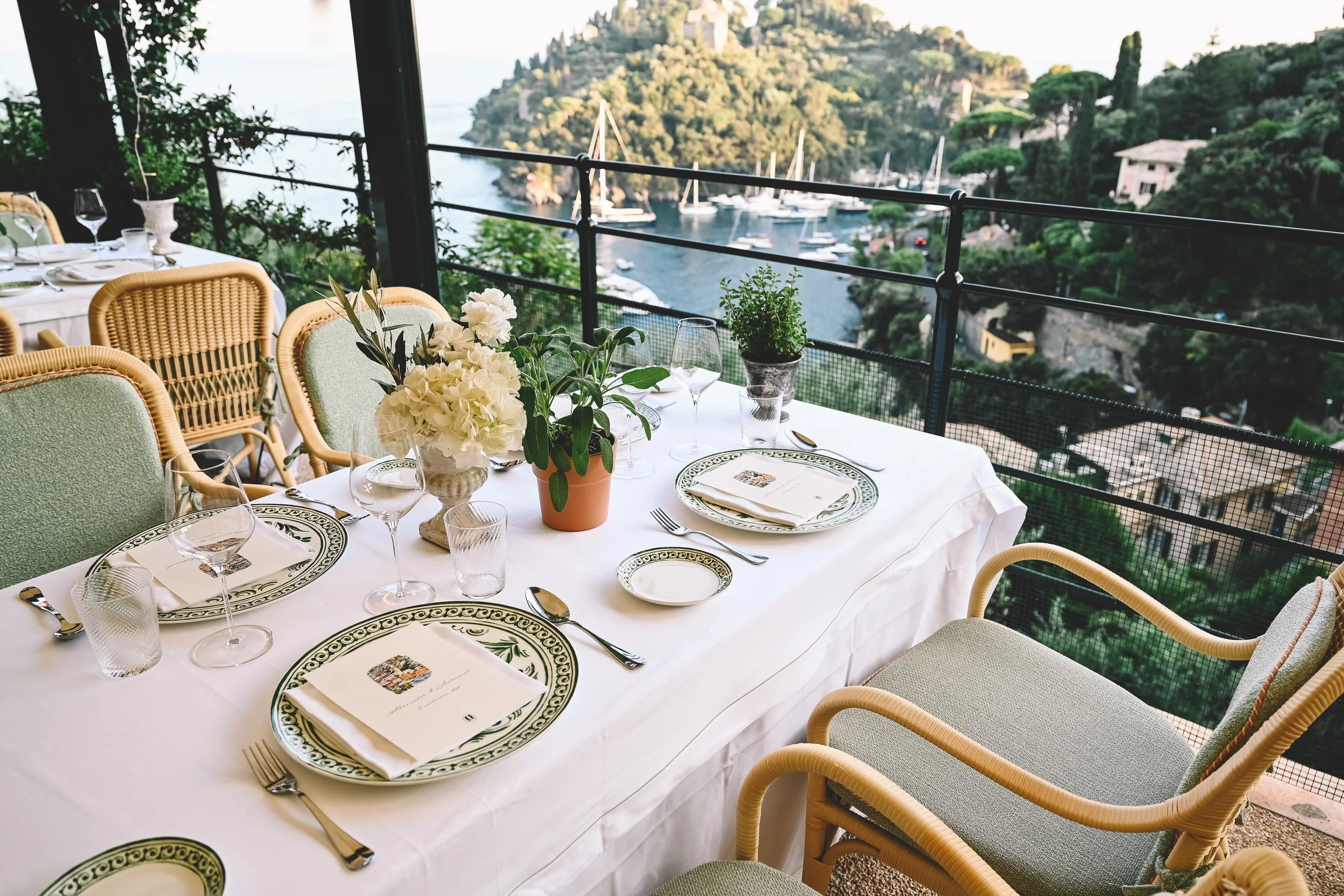Elegant outdoor wedding table overlooking Portofino at the Belmond Splendido, captured in a refined documentary style by NYC destination wedding photographer Robert Carlo.