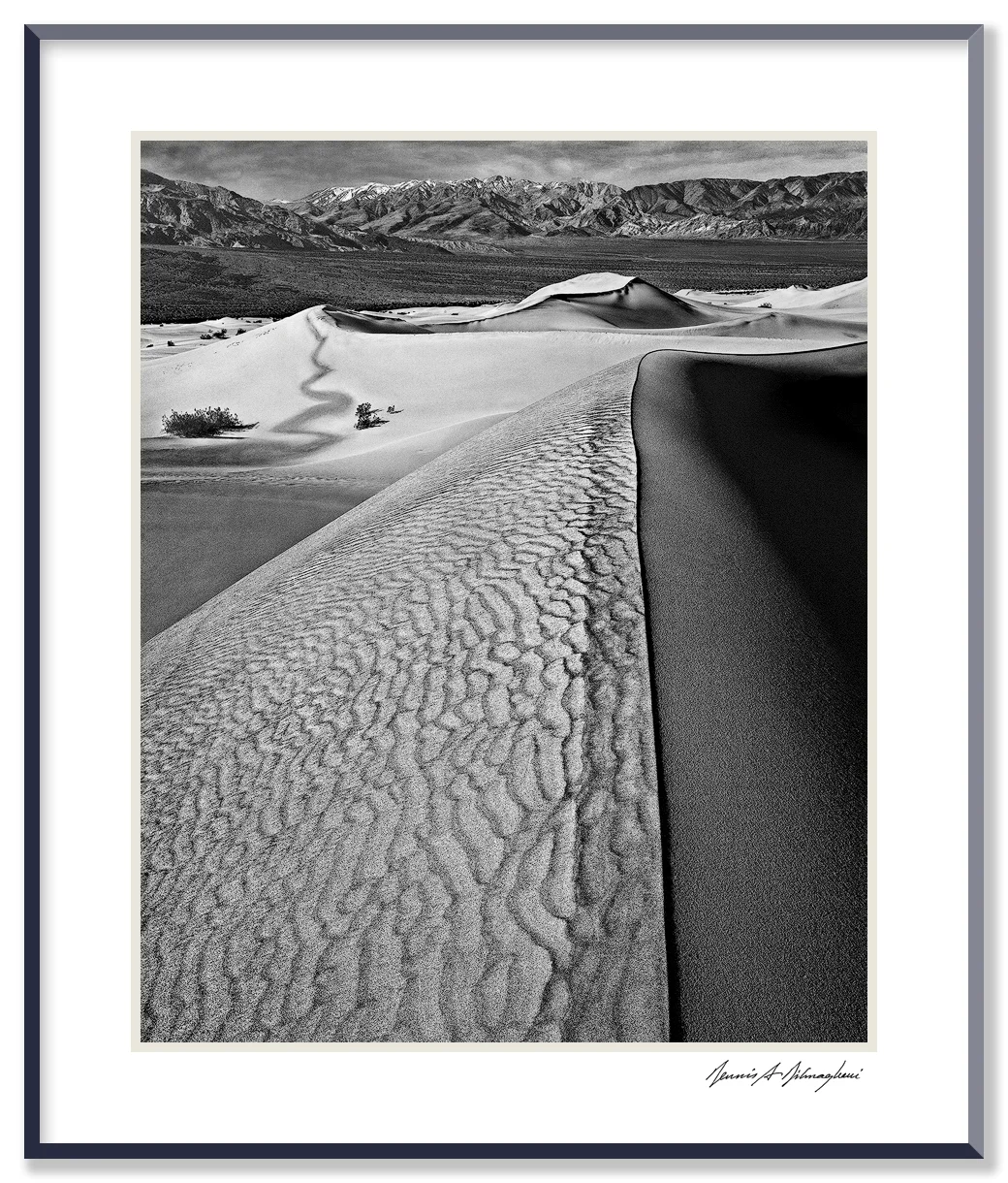 Sand Dunes - Death Valley National Park - California Photographing on sand dunes is challenging. It's usually windy with sand blowing constantly around your feet and sometimes rising high into the air. Protecting the camera and lens is most important. Positioning tripod legs on sand is difficult.
