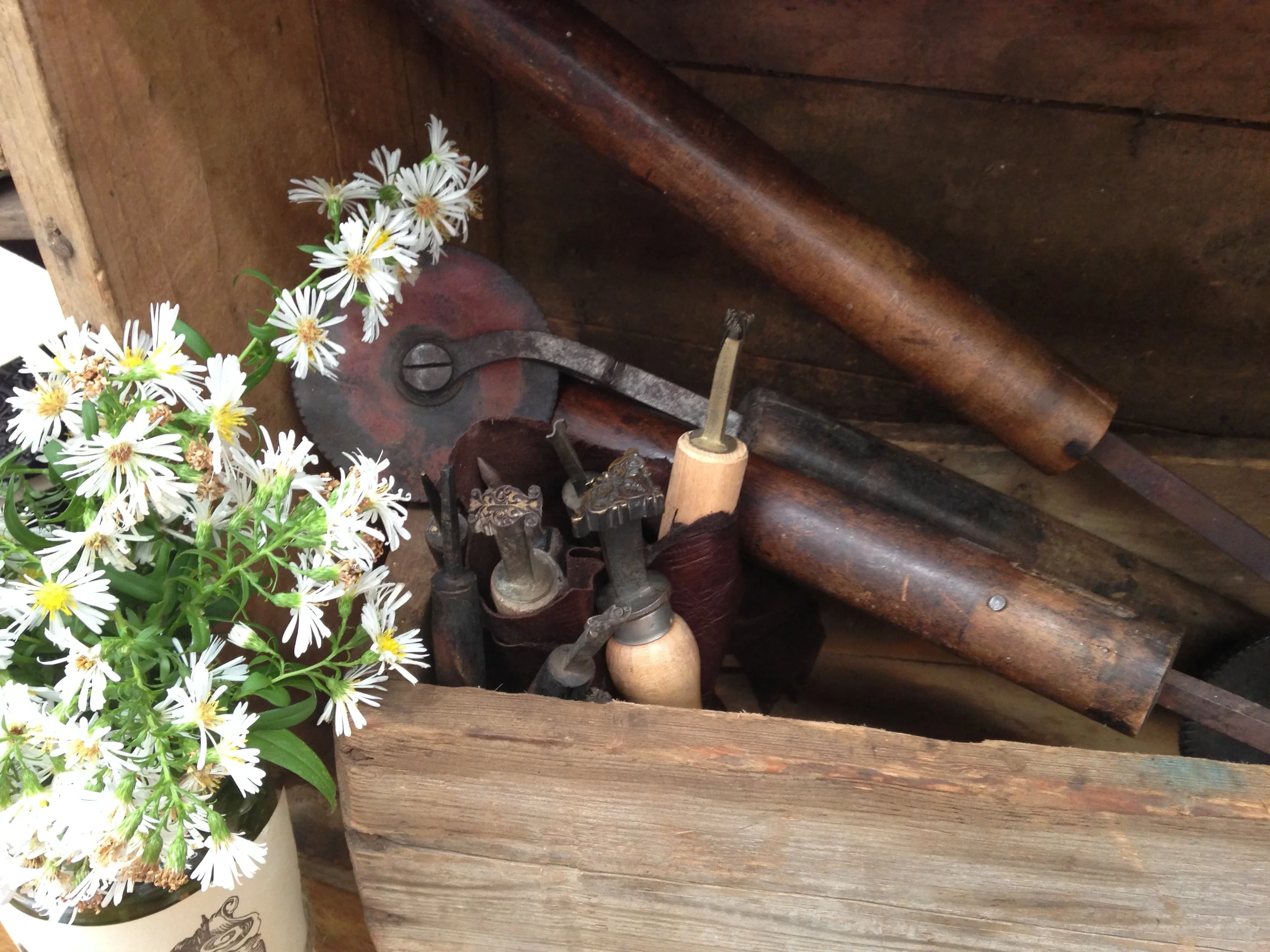Collection of hand tools used to finish leather books