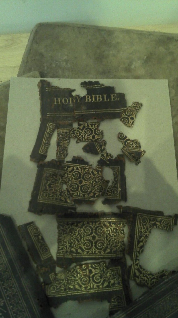 Fragments of a book spine removed during restoration