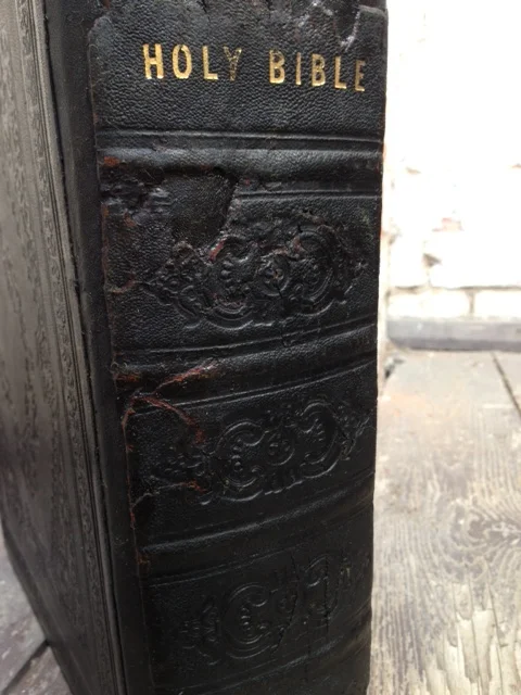 The remnants of the original spine, reinstated on the newly crafted leather spine