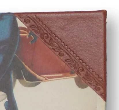 Leather corners and spine finished with decorative hand tooling