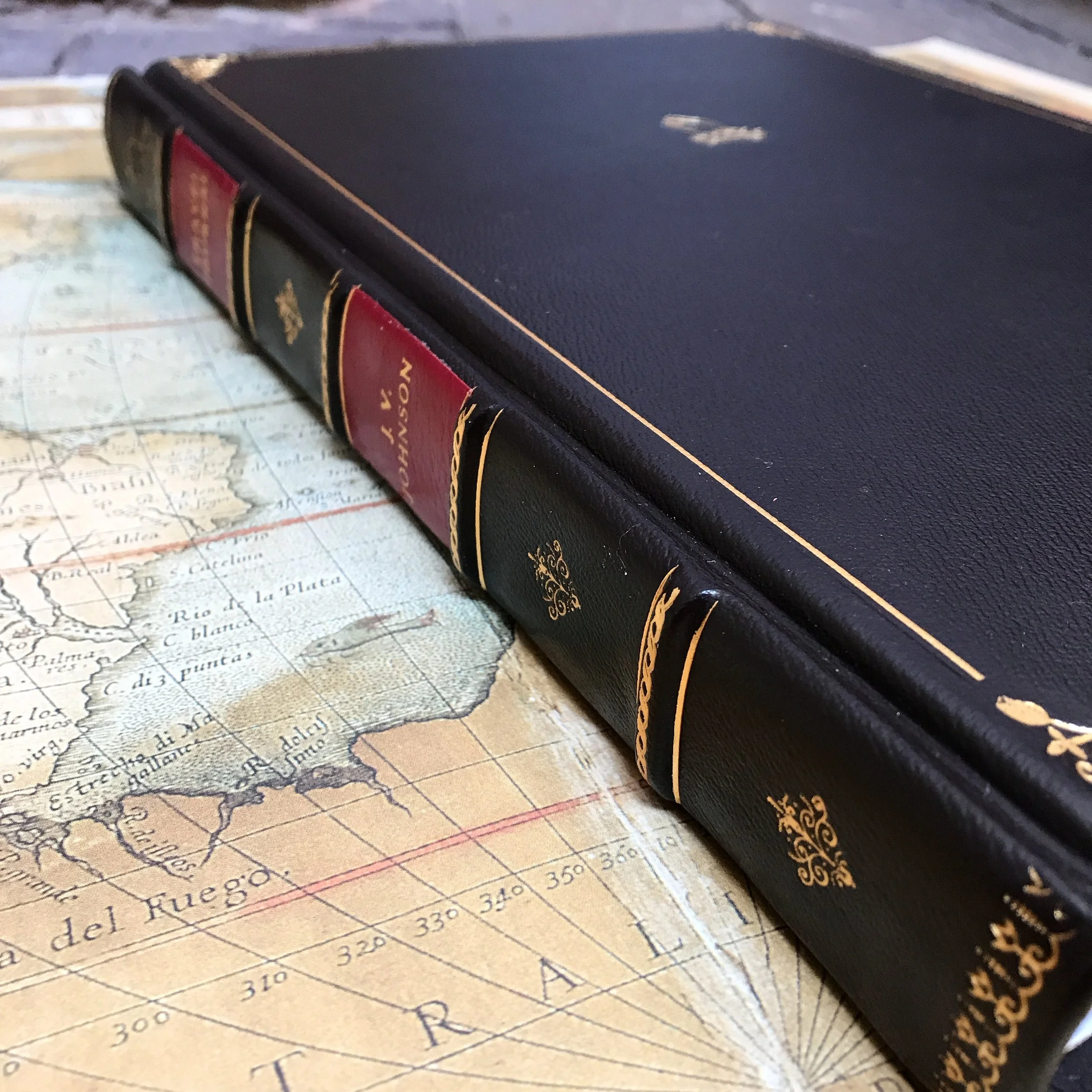 Traditional full goatskin binding with gold tooling and skiver labels