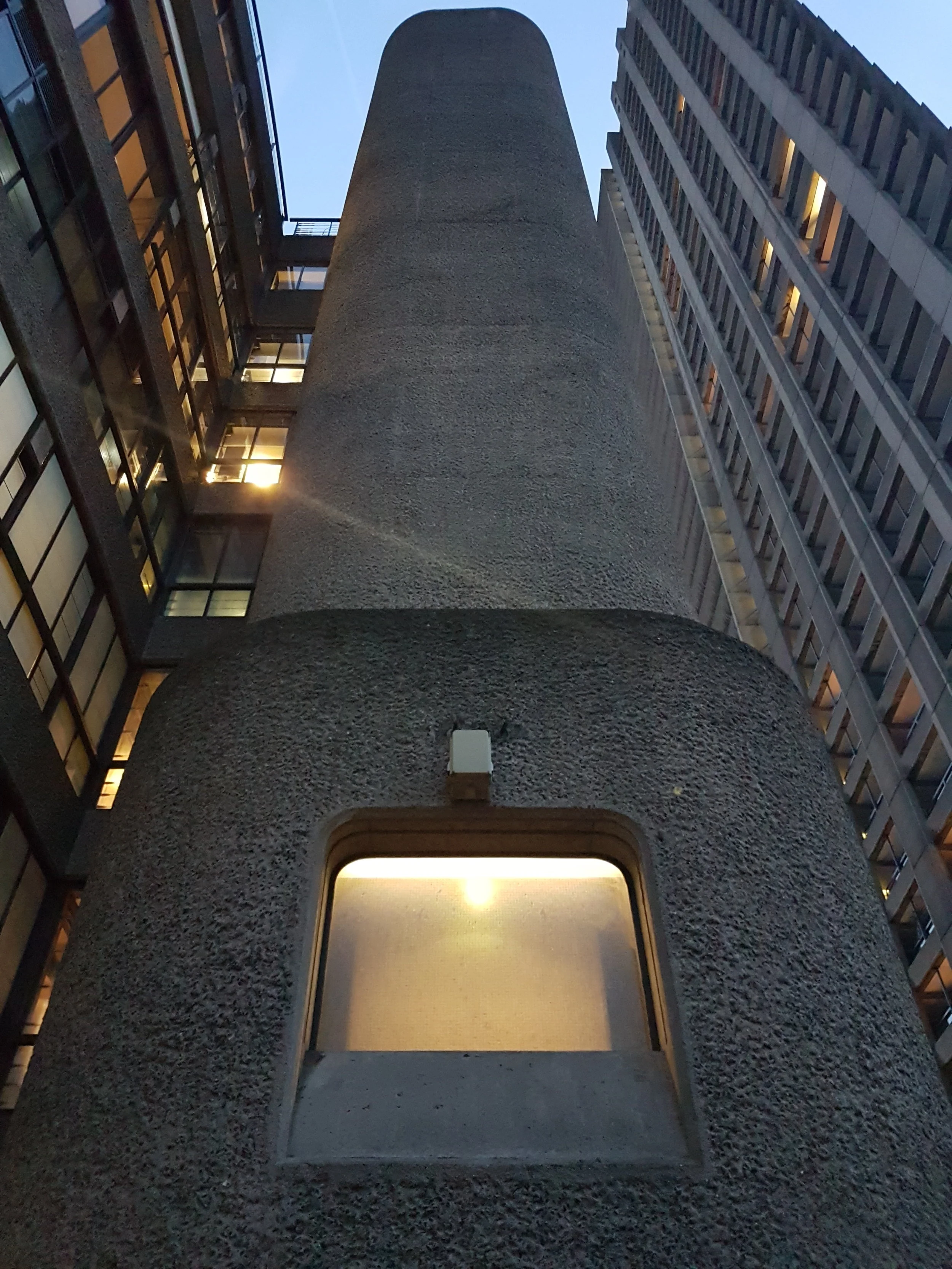 Details such as light fixtures and window frames were all custom designed for this project. The textured concrete walls were hand-drilled on the exterior and interior surfaces.