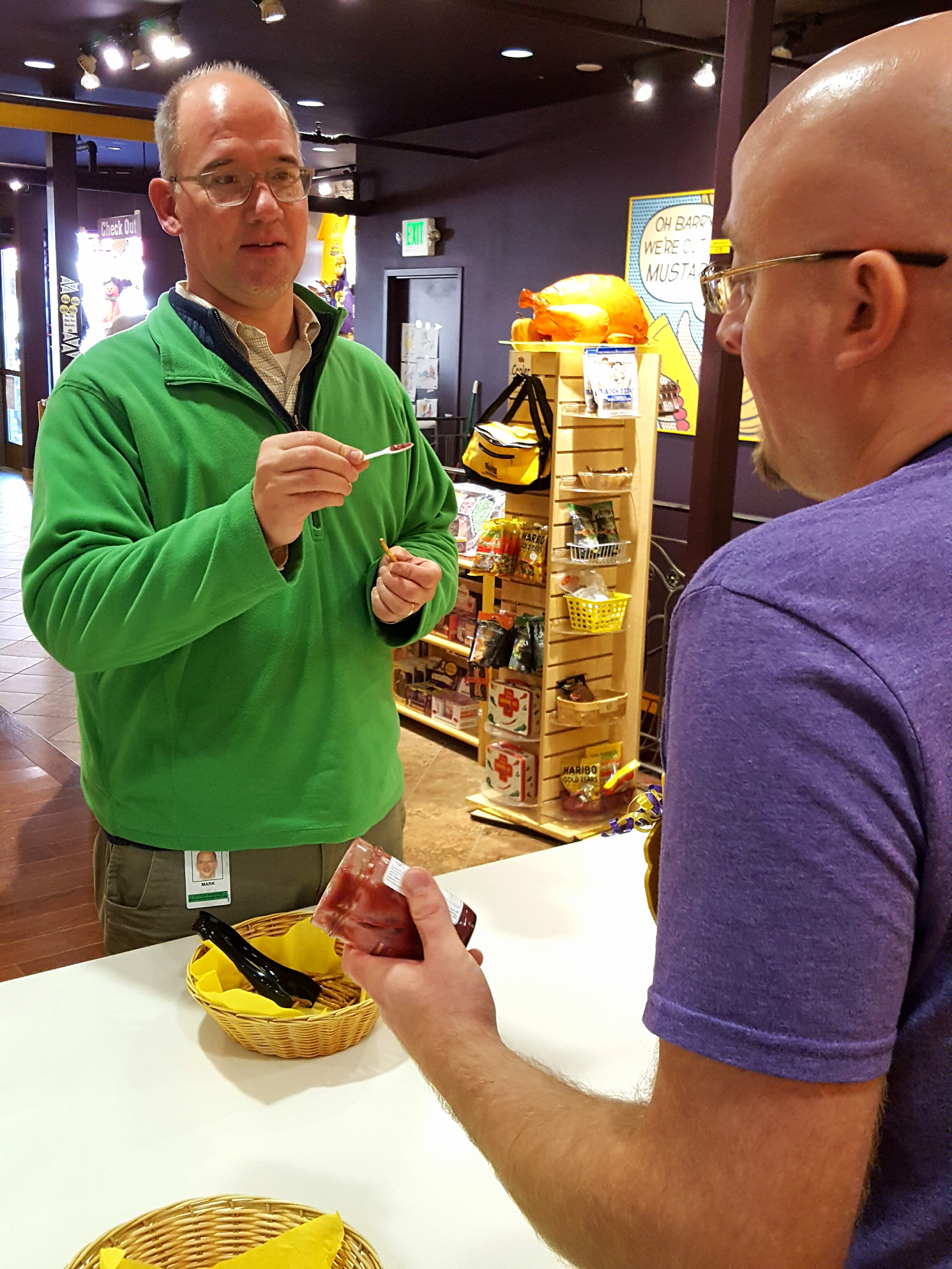 Customer Mark Werner tries out a variety of mustards.