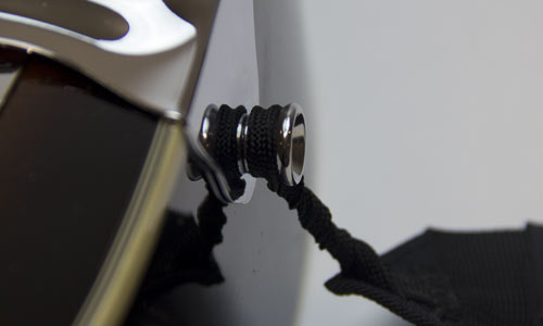 2) Twist leash loop until it is tight against the strap button.