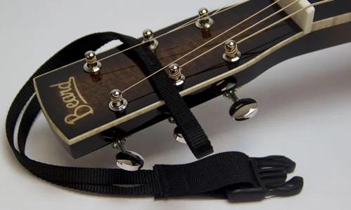 2) Slip loop between upper sets of tuners and under strings.
