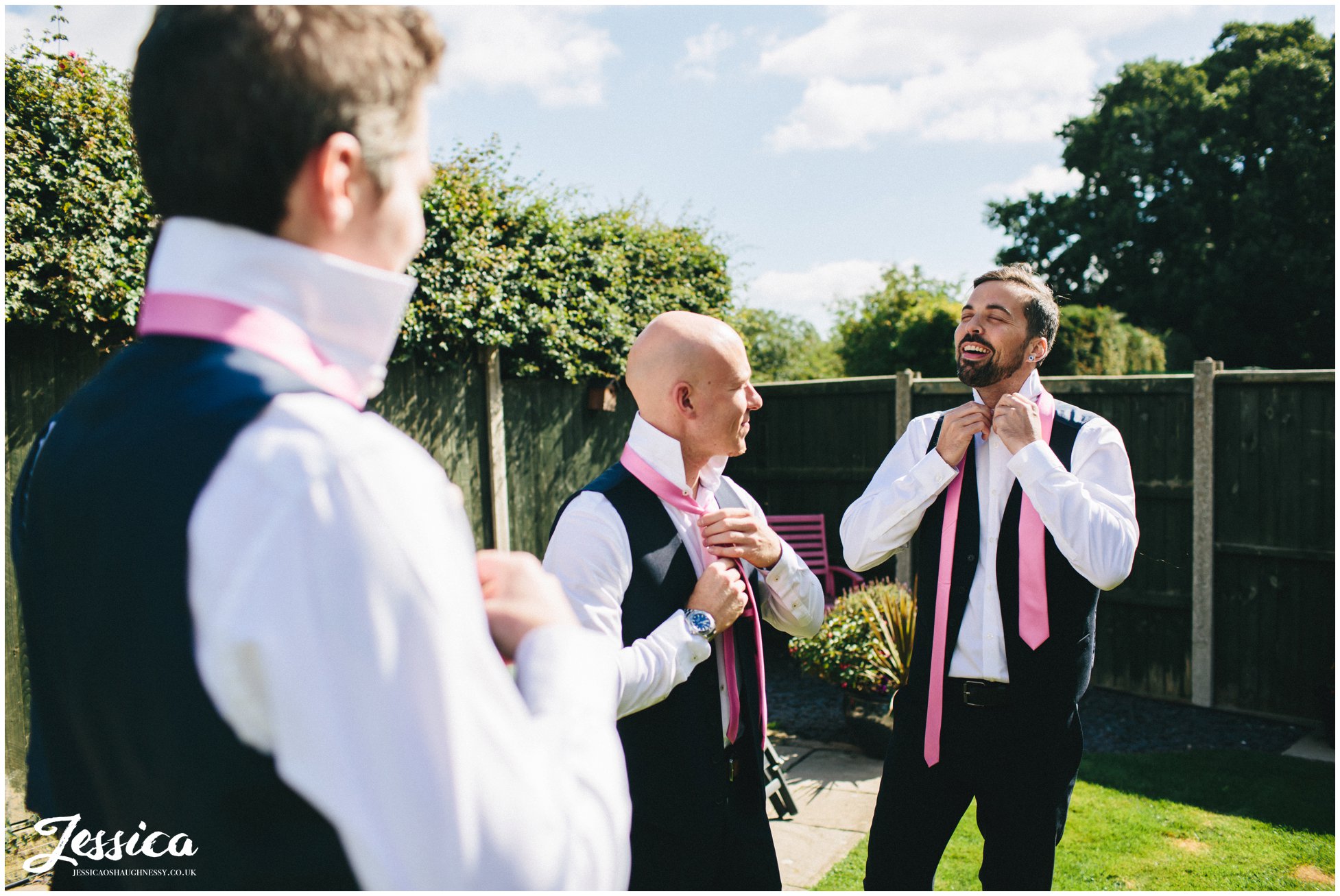 groomsmen fasten ties ahead of the wedding ceremony - north wales wedding