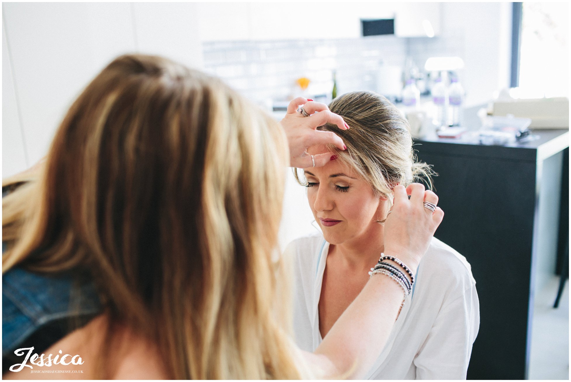 bride having final touches to hair & makeup on the morning of her wedding in north wales