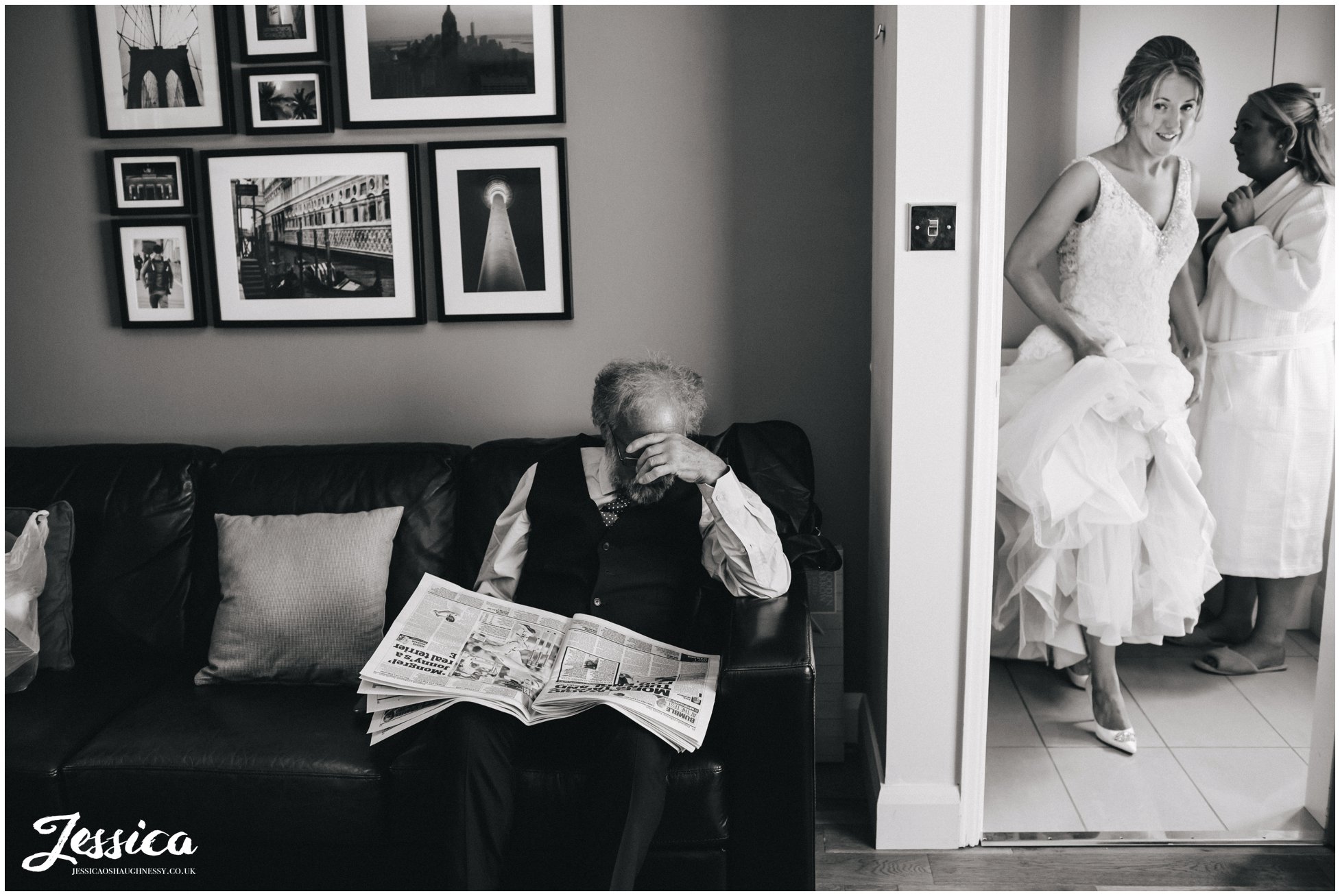 father of the bride reads a newspaper on the morning of the wedding day in north wales