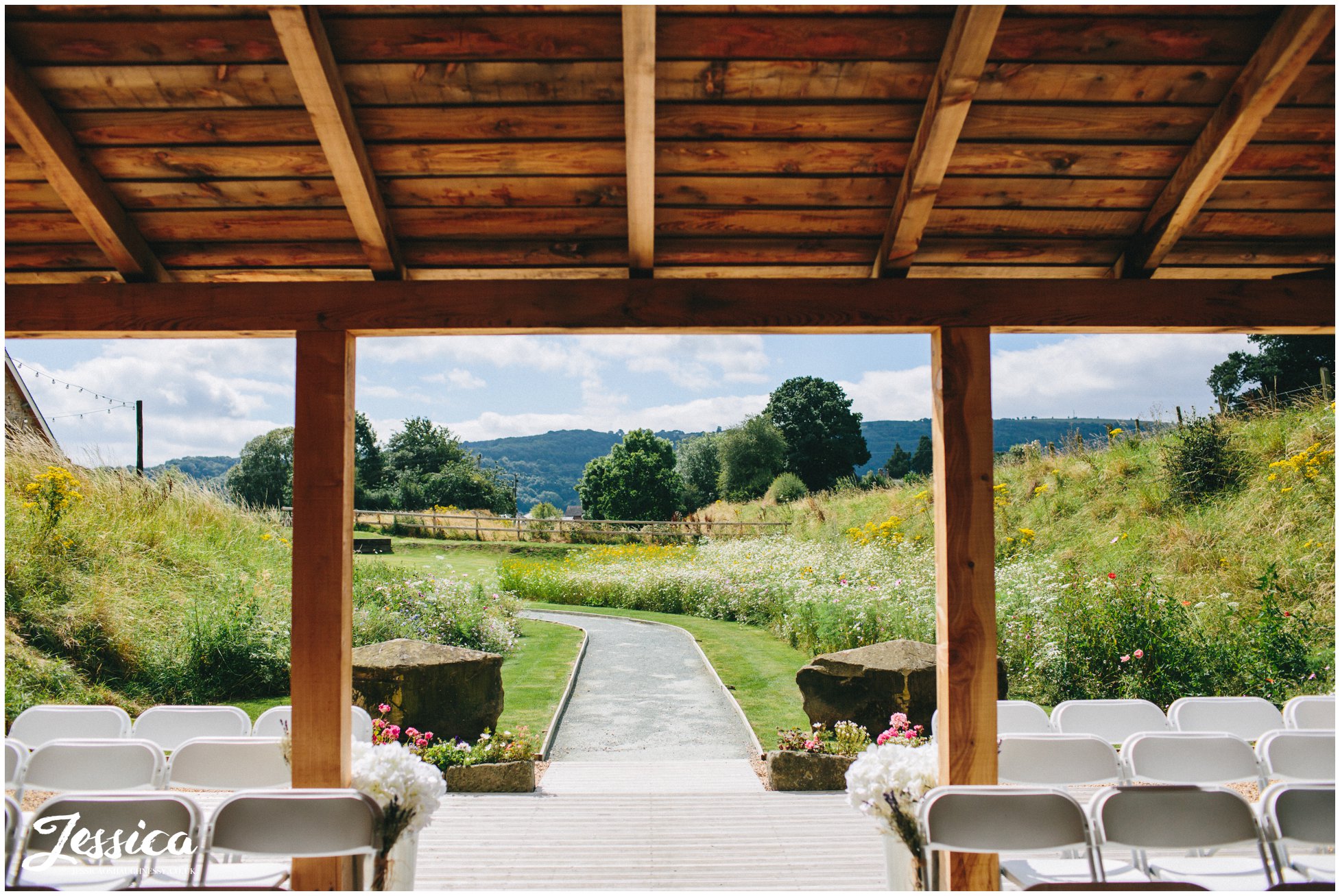 view of the pathway leading to the bridge at tower hill barns