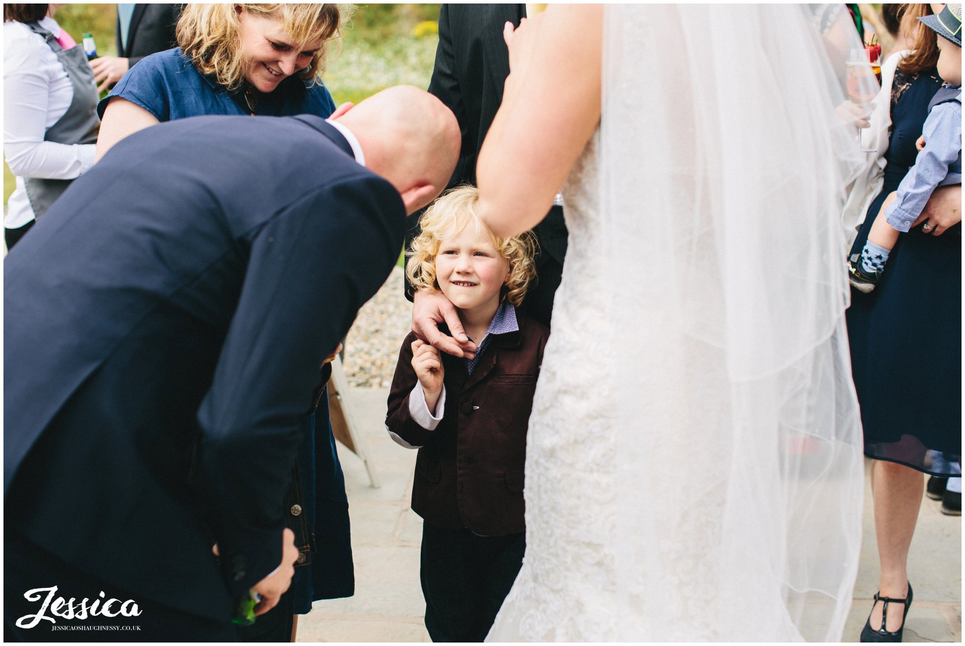 child speaks to the groom on his wedding day in wrexham
