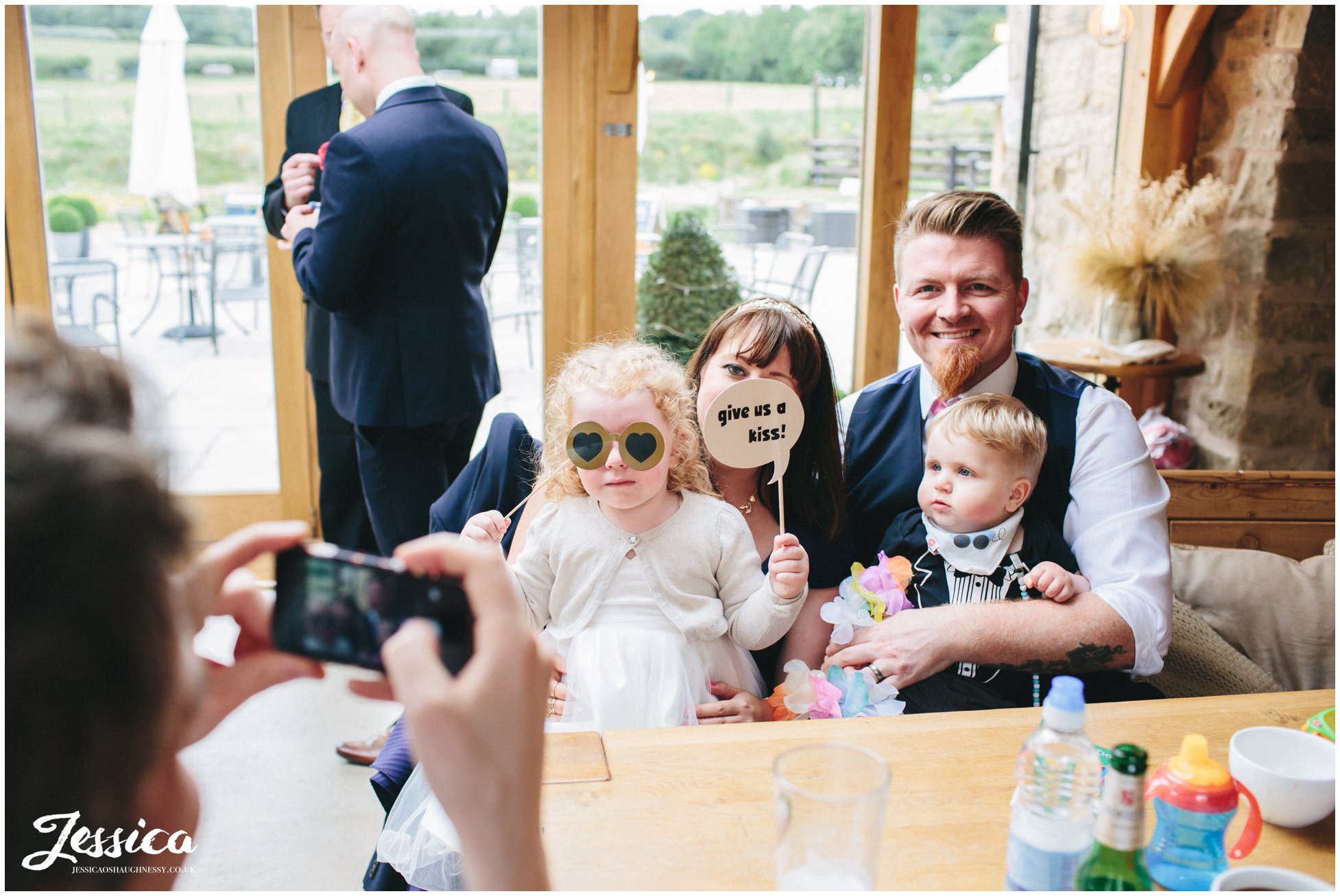 family pose for a photograph during the wedding reception at a north wales wedding
