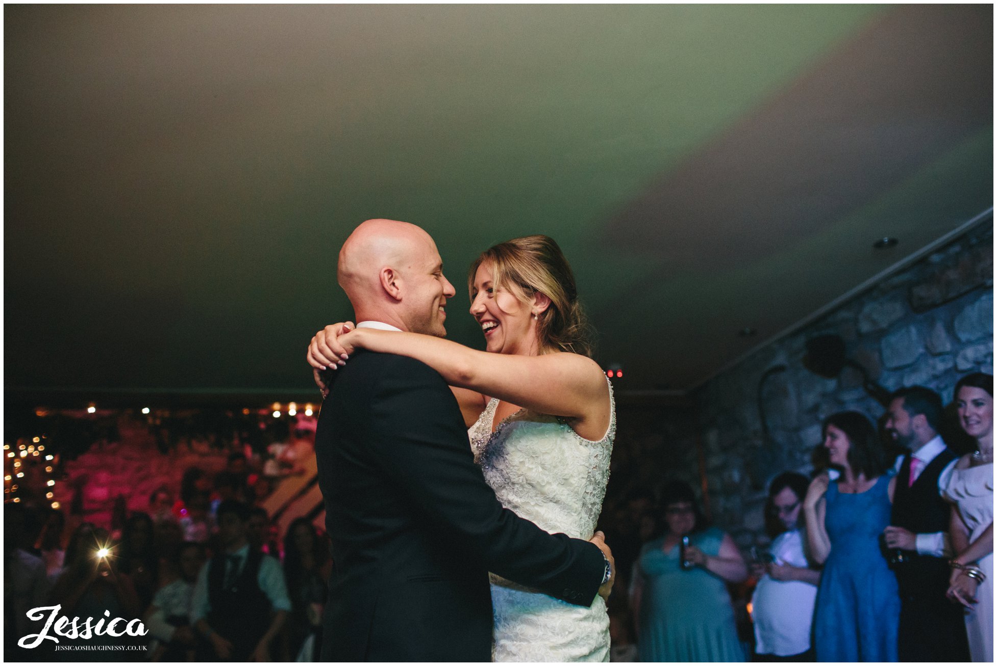 bride & groom sharing their first dance in 'the build' - tower hill barns in north wales