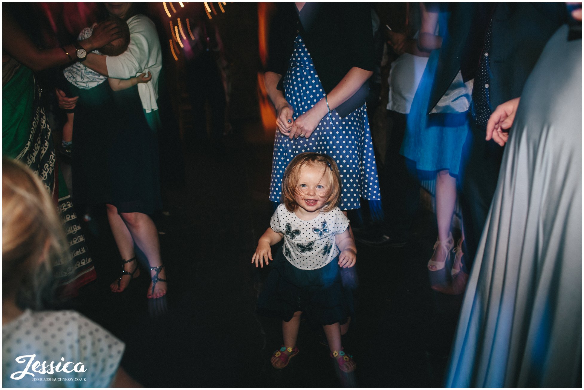 child on the dancefloor in the barn at tower hill barns