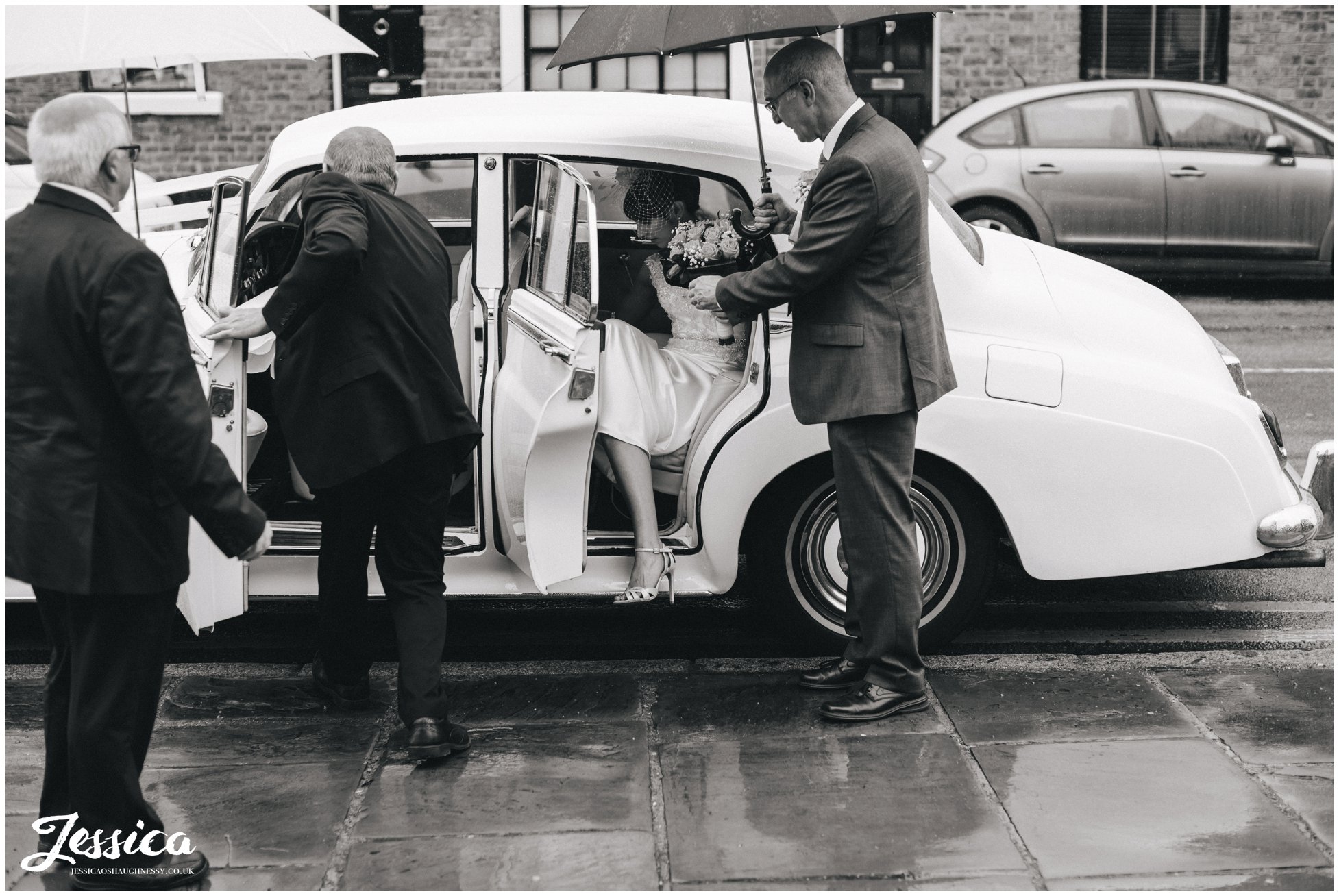 bride arrives at st mary's church for her wedding in chester