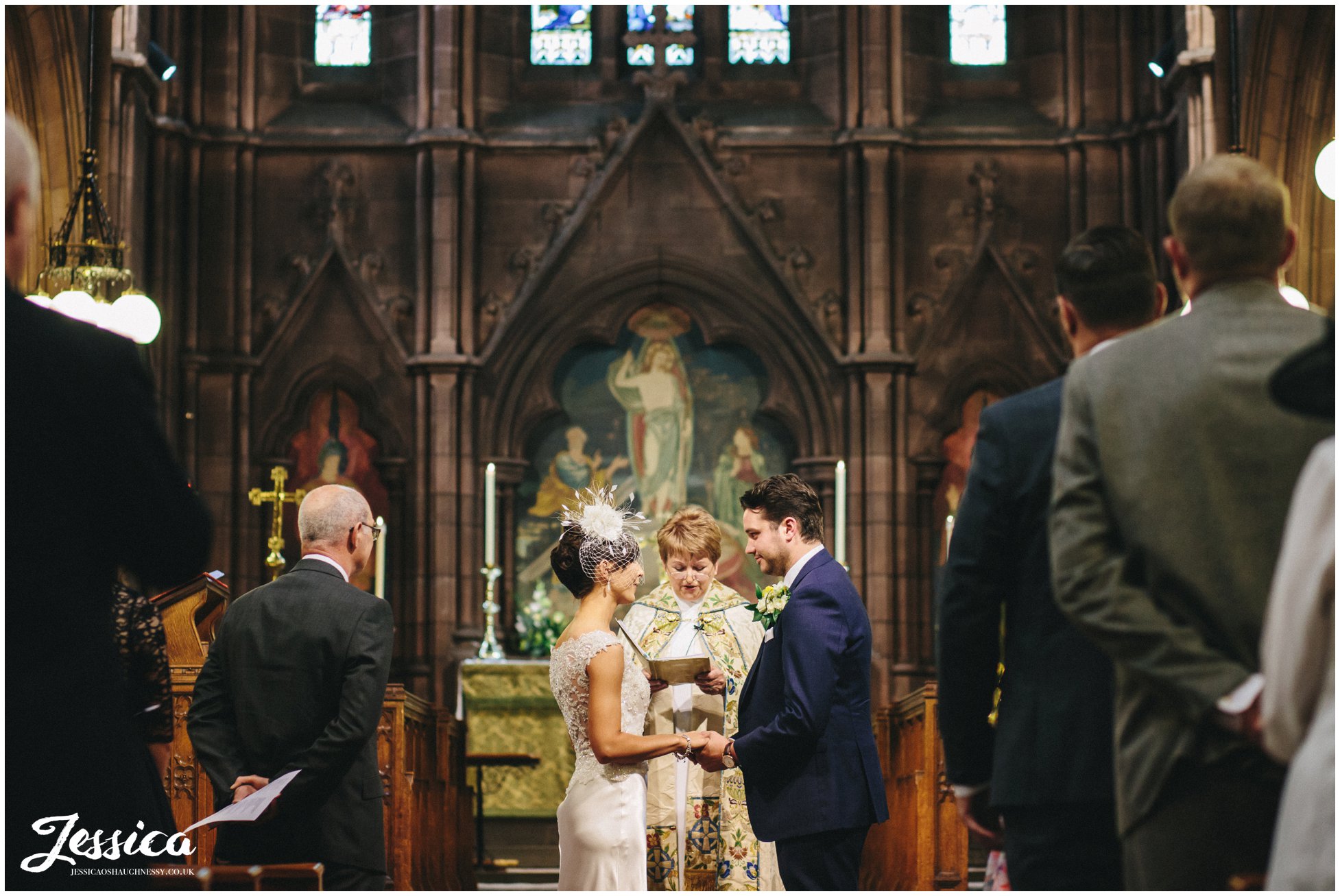 Bride & Groom saying vows at their wedding in Chester Church