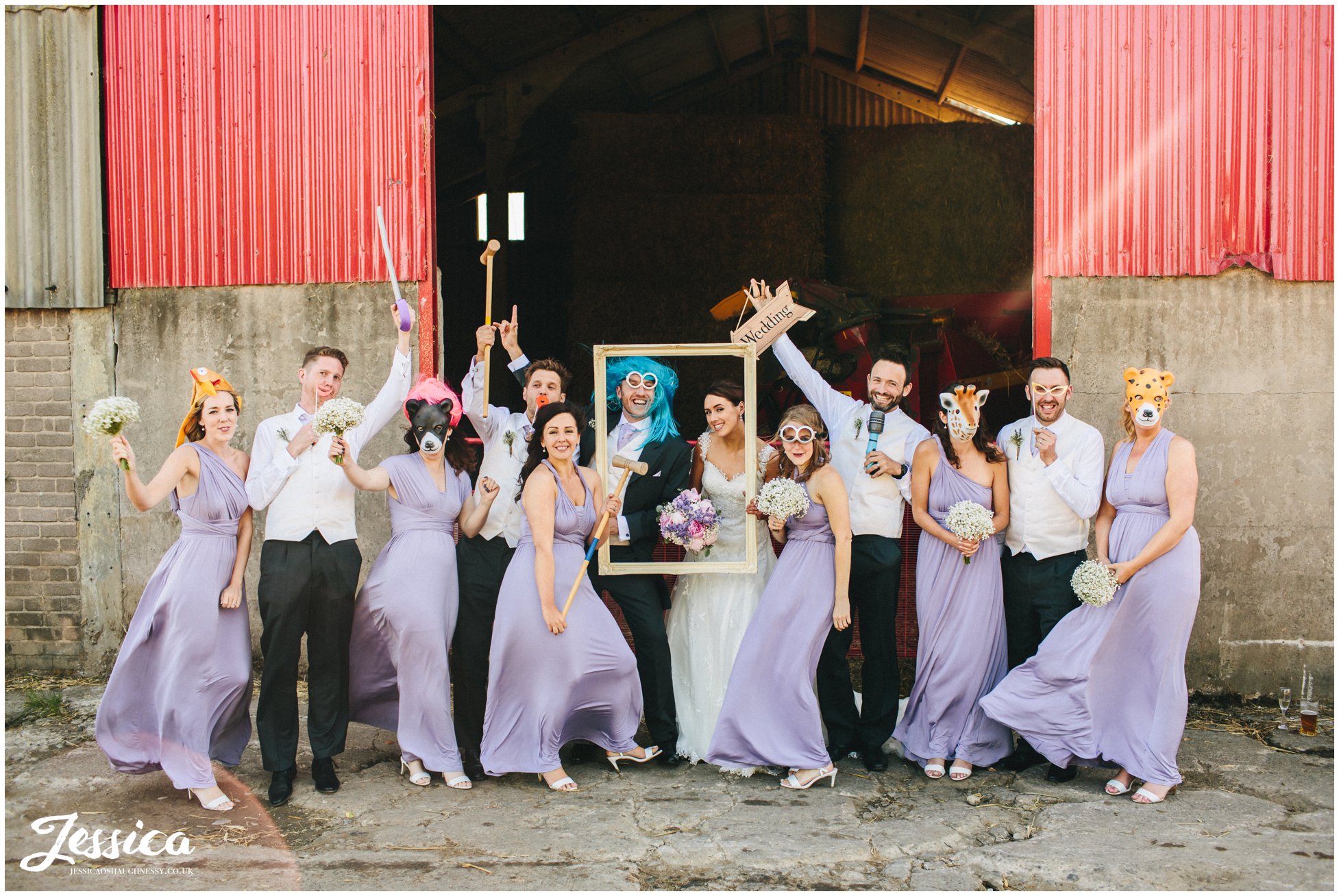 guests pose with props infront of farm gate at Three Hills Barn, Torpenhow