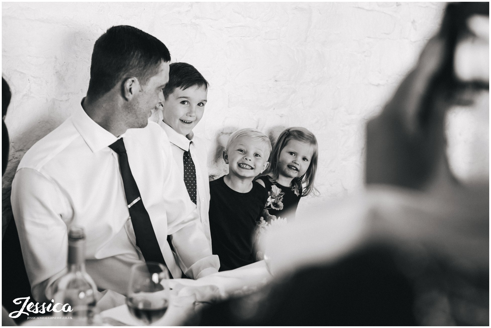 children pose for a photograph at an askham hall wedding