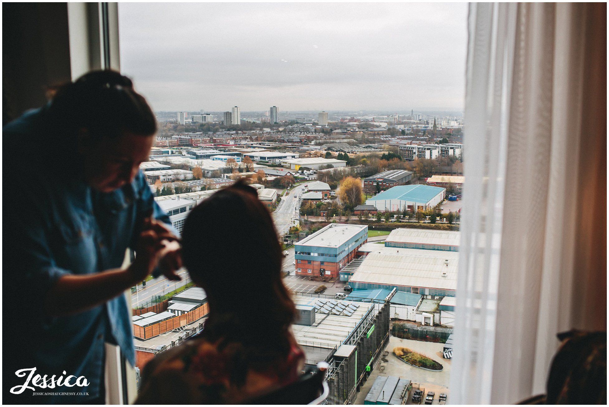 bride having her make-up done overlooking views of salford quays