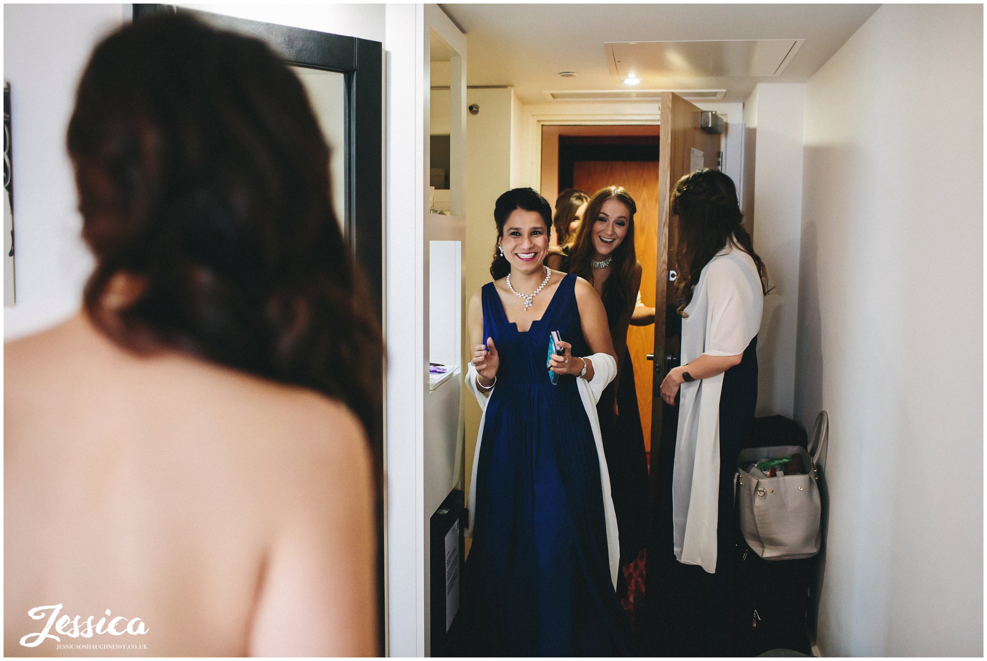 bridemaids see the bride in her dress for the first time - manchester wedding photographer