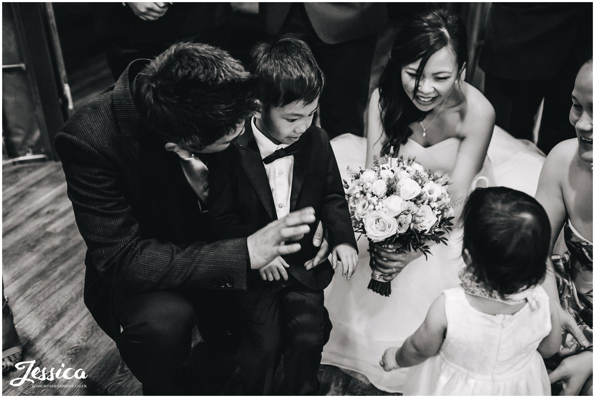 newly wed's play with children at their wedding reception in salford, manchester