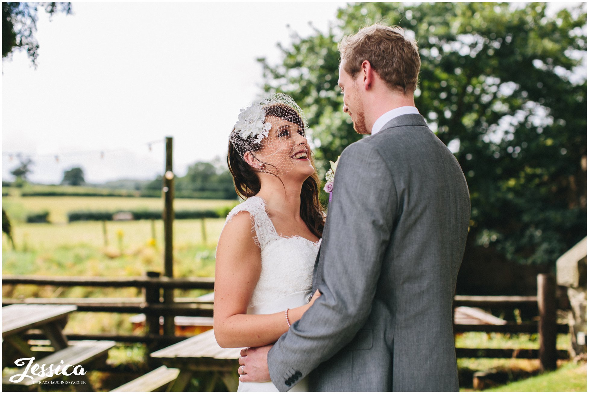 newly wed's embrace at their wedding in north wales