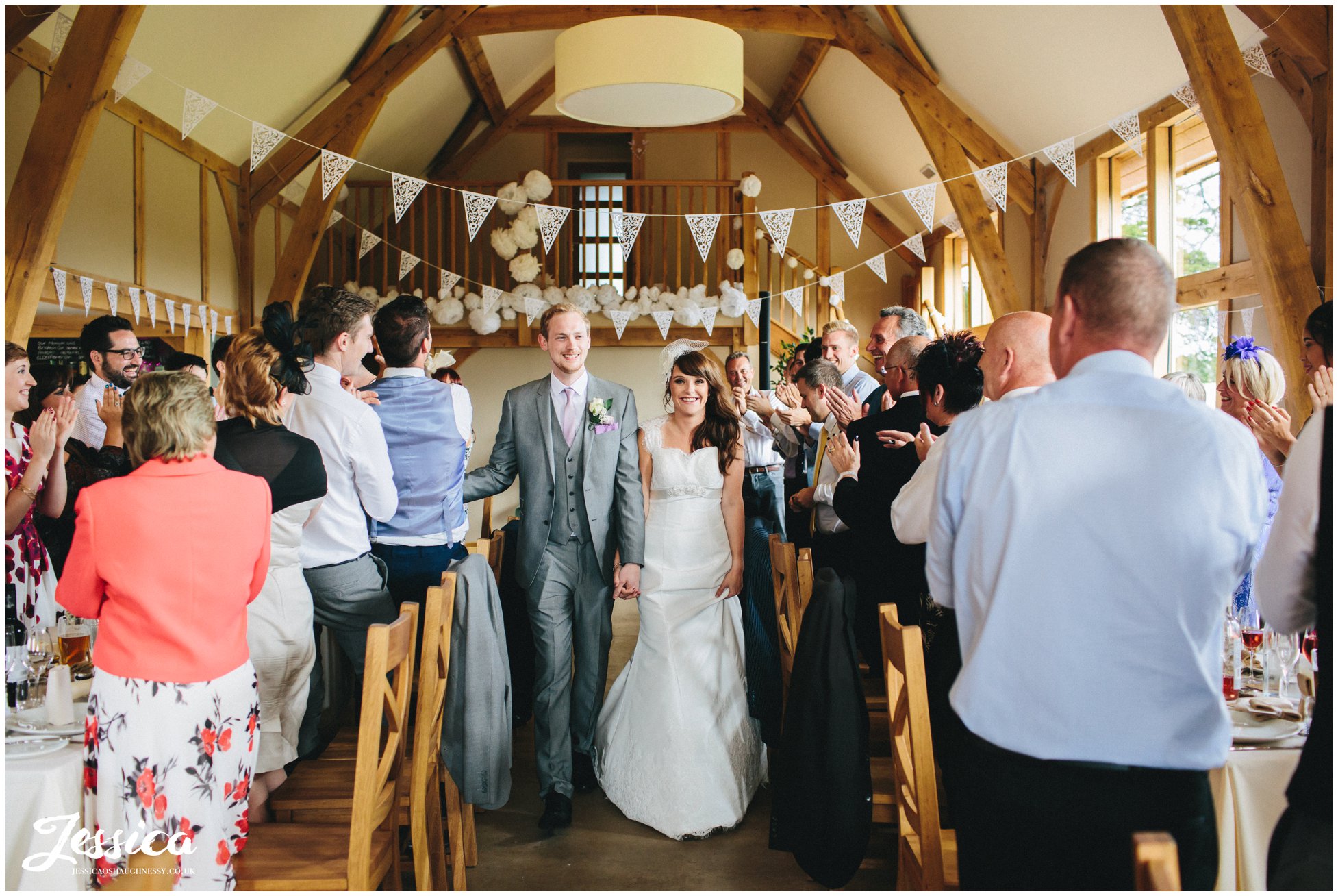 bride & groom our announced into their room as husband & wife at their north wales wedding