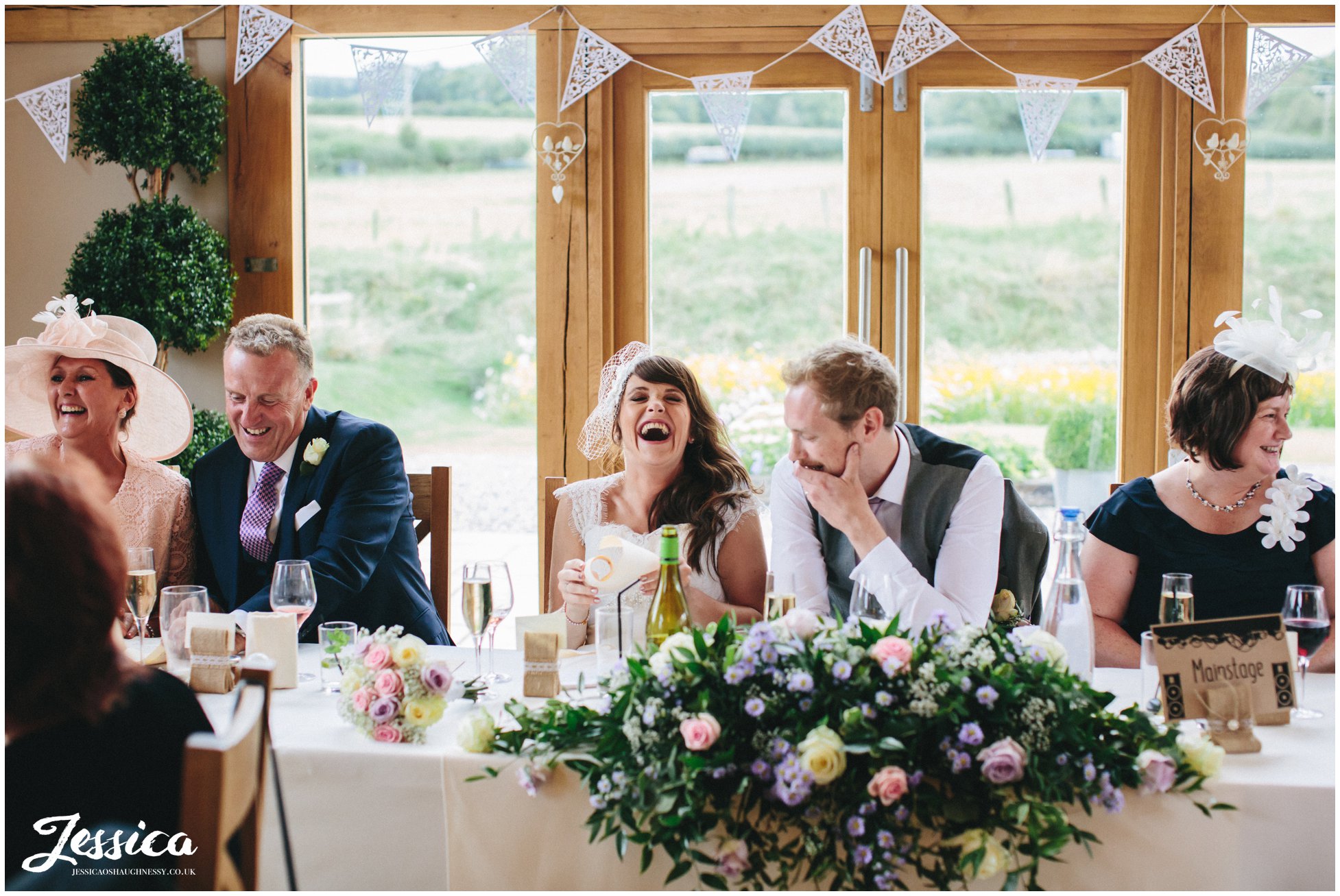 top table laughing during the speeches