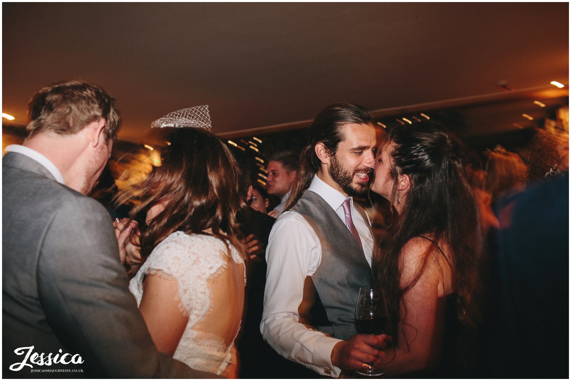 couple kissing during a wedding reception in north wales