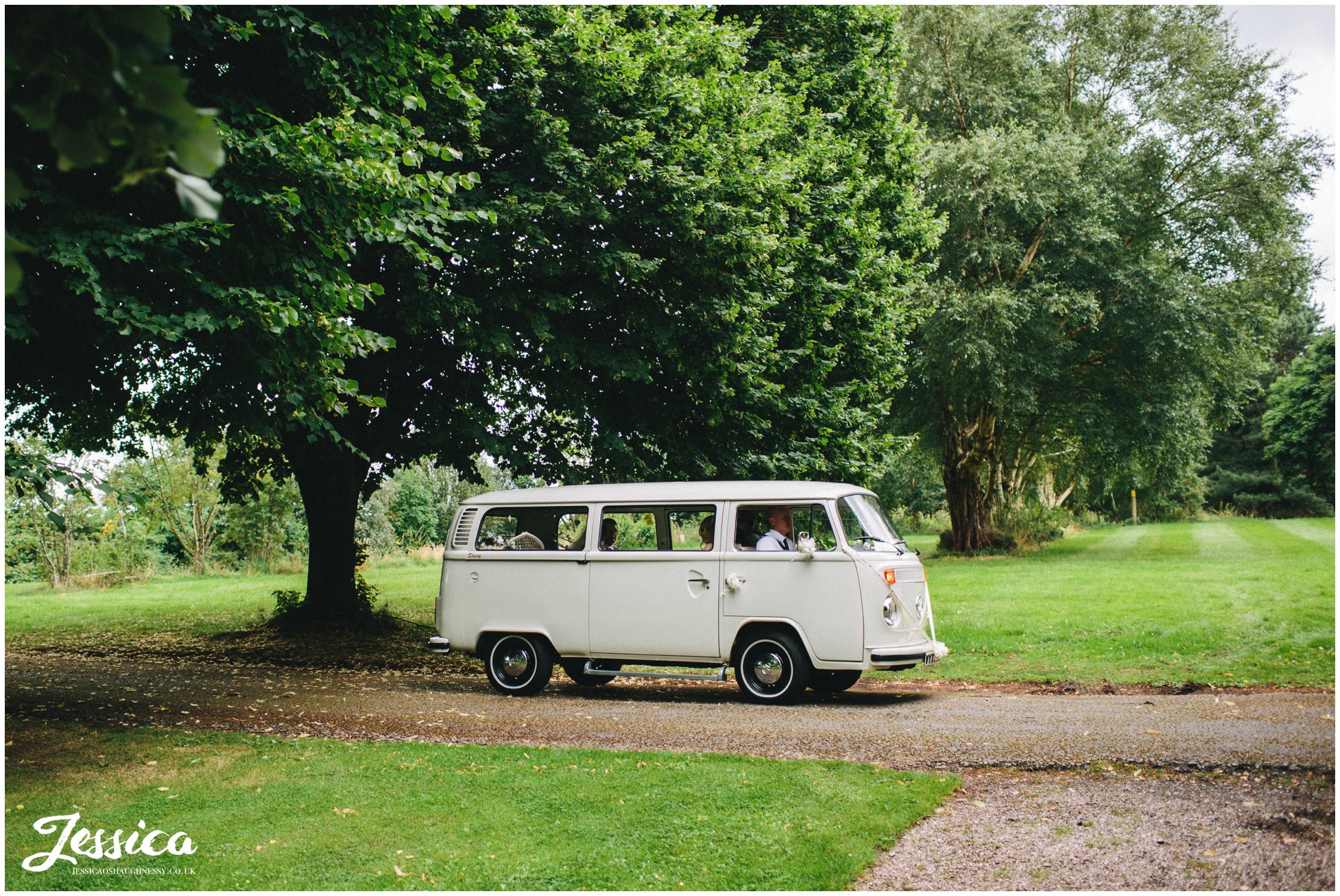 bride arrives at her ness gardens wedding in a cream VW camper van