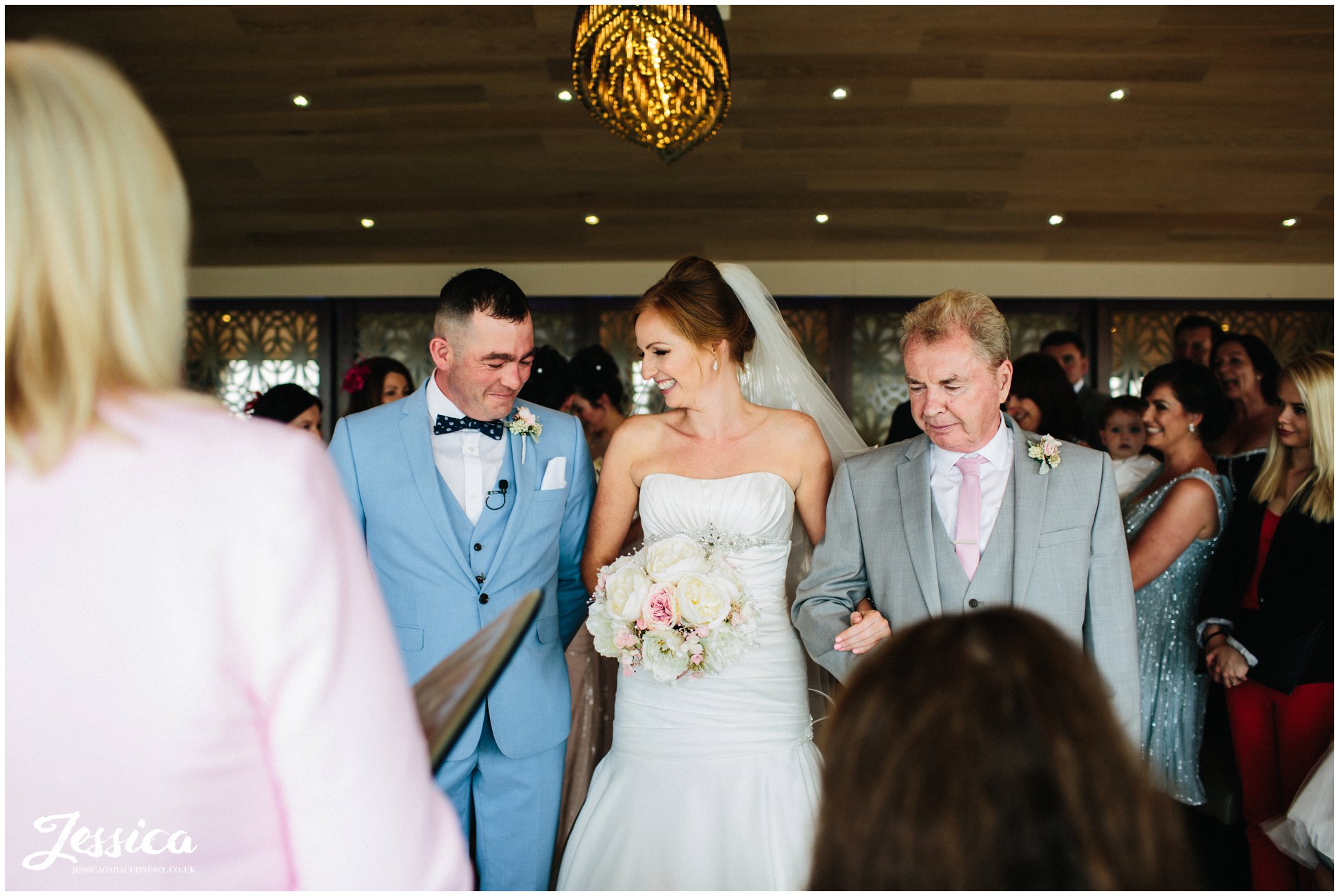 bride & groom meet eyes for the first time at their wedding on the wirral