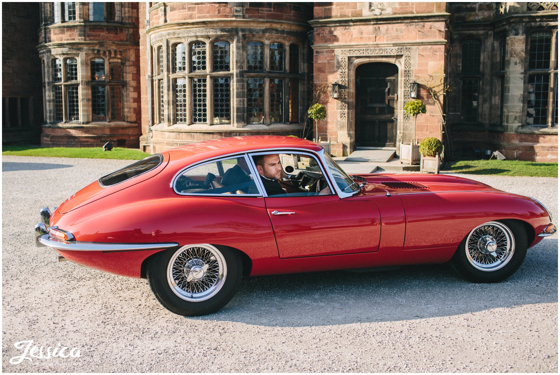 Groom pulls up to his wedding on the wirral in an e type jag