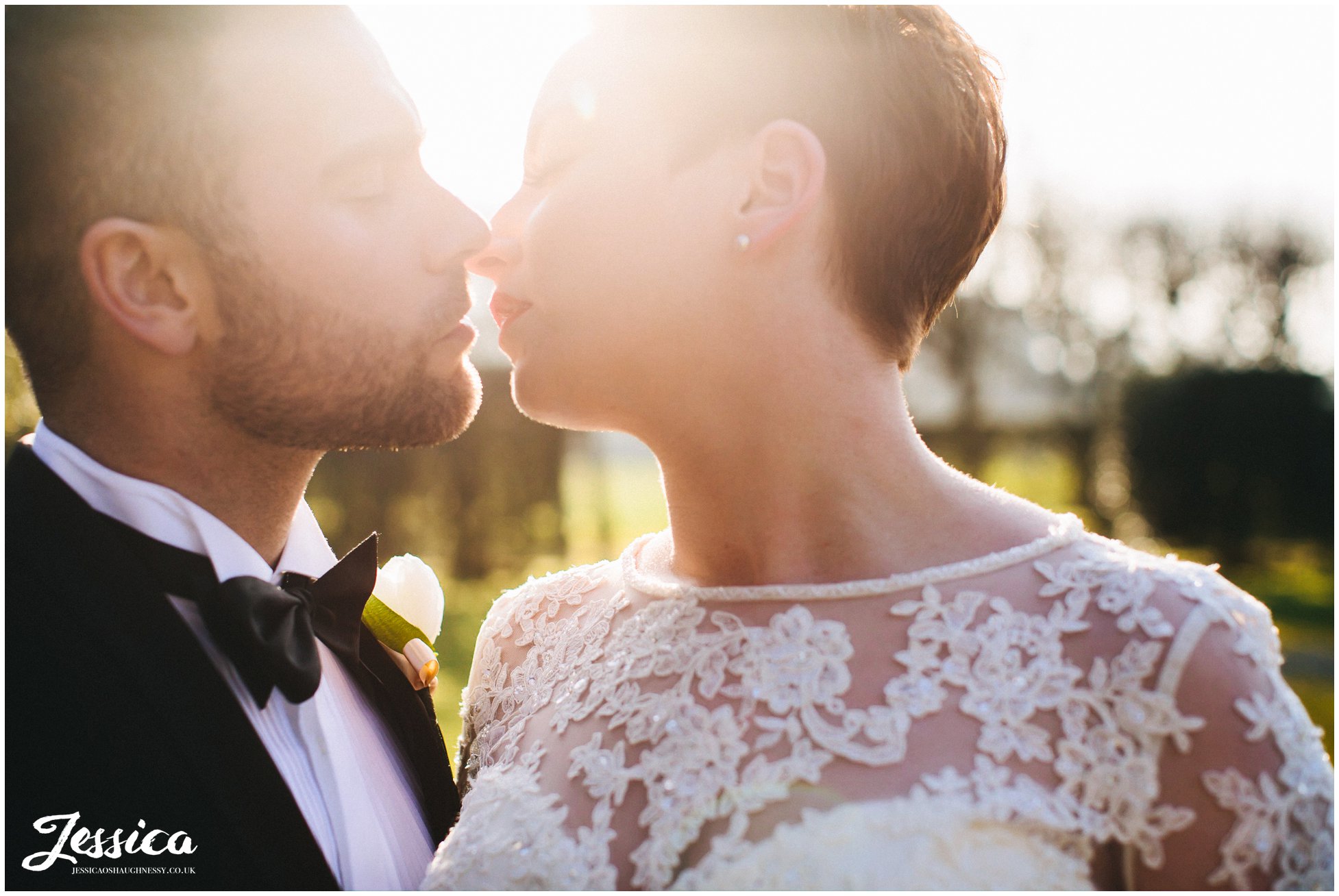 bride & groom in golden hour on their wedding day on the wirral