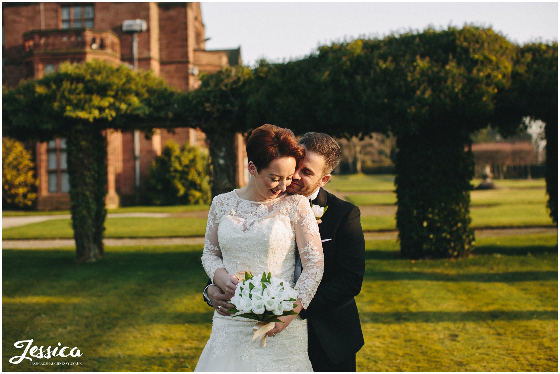 bride & groom basque in the sunlight on their wedding day at thornton manor