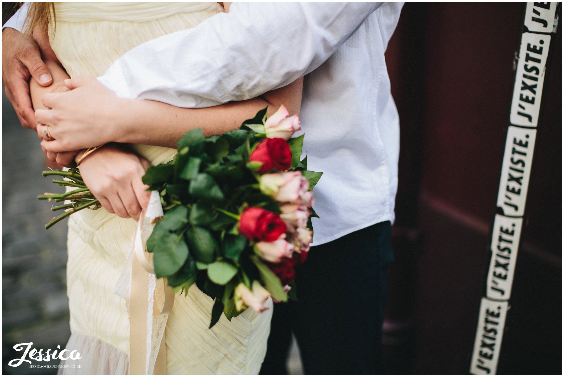 close up of bride holding her wedding bouquet in paris