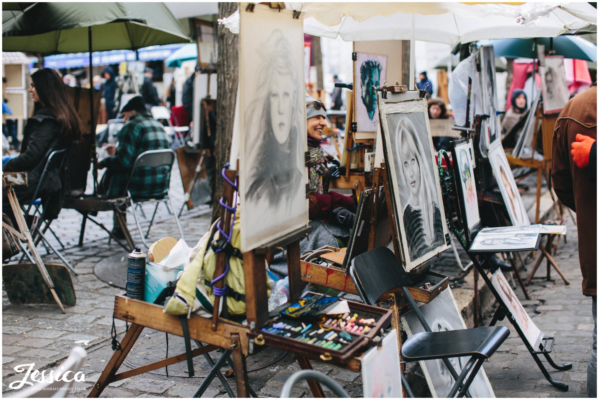 artists paint in the square in mont marte, paris