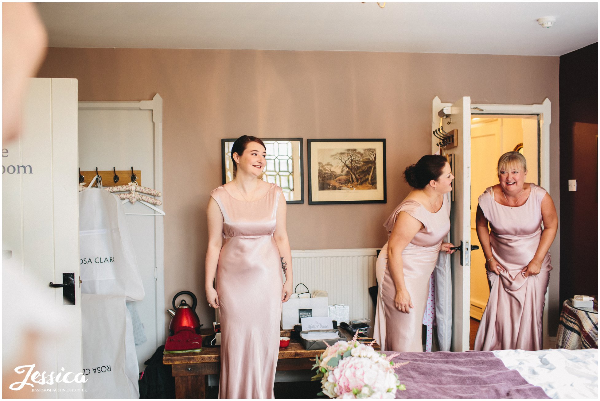 bridesmaids seeing the bride in her dress for the first time - cheshire wedding photographer