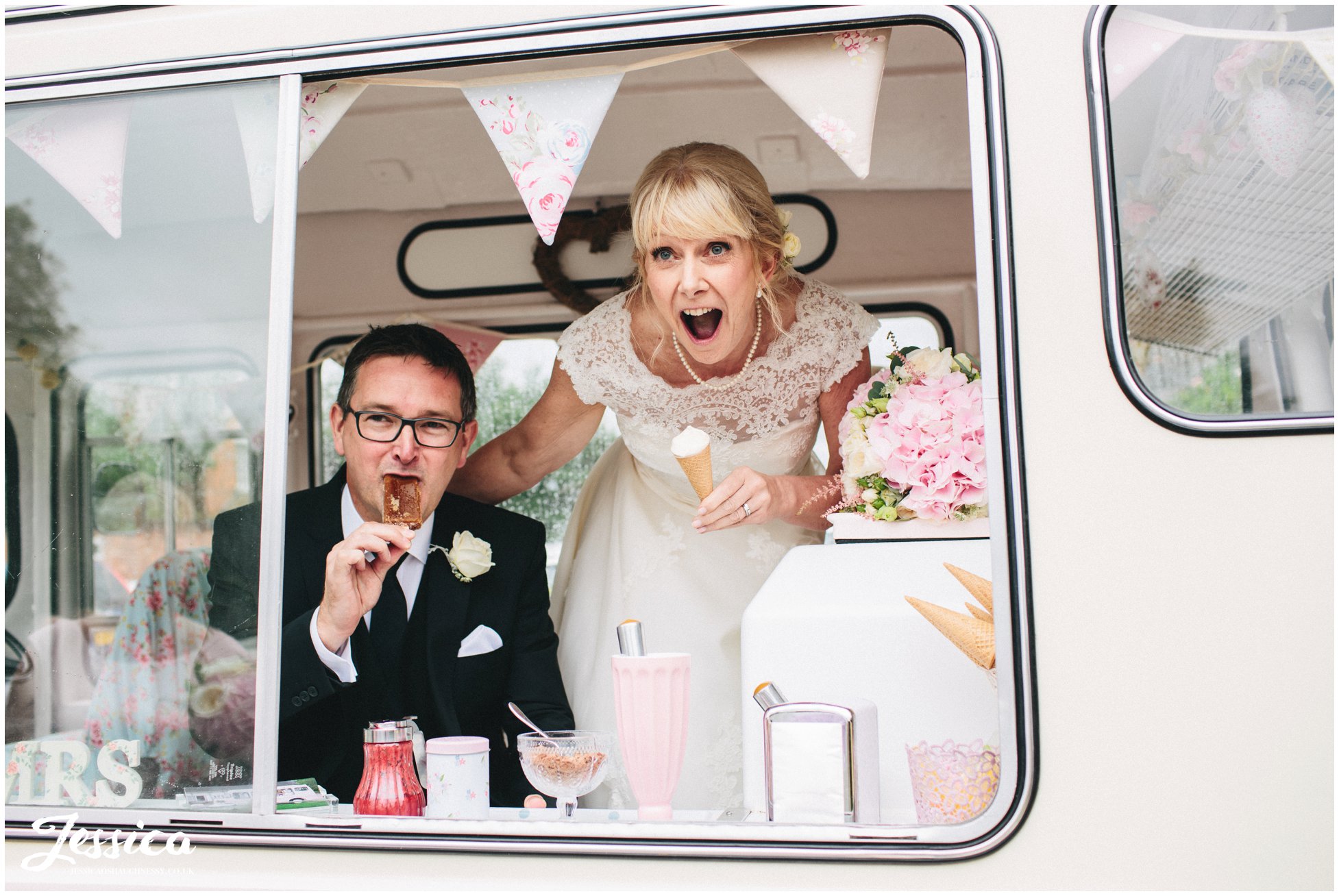 bride & groom eating ice-creams inside a vintage ice-cream van at their cholmondeley arms wedding