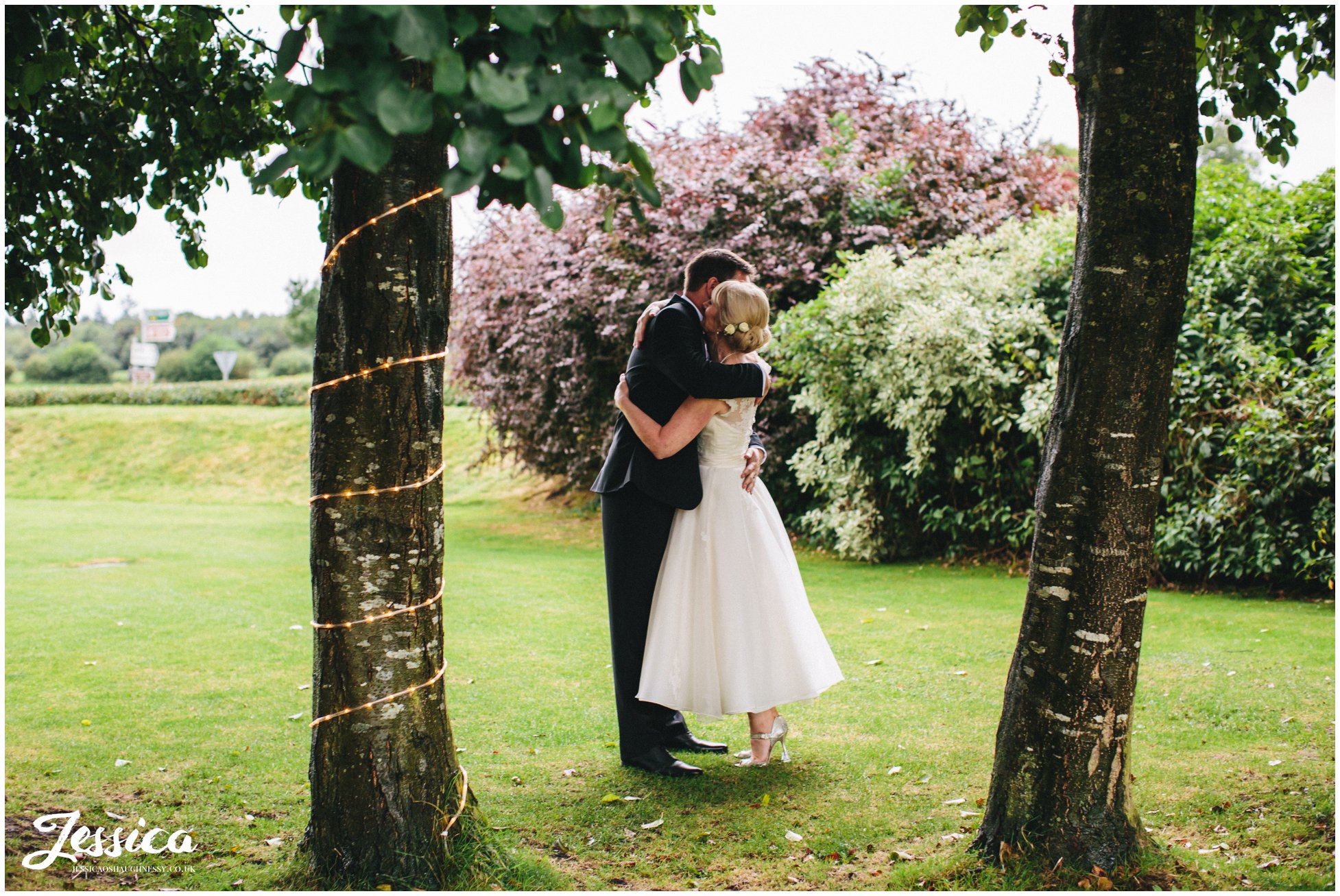 bride & groom hug on their wedding day at the cholmondeley arms