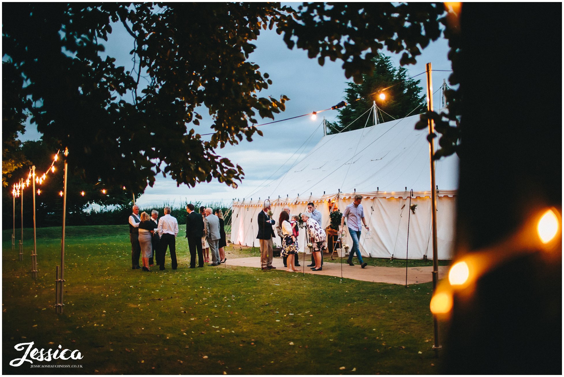 cholmondeley arms wedding marquee lit by fairy lights at night