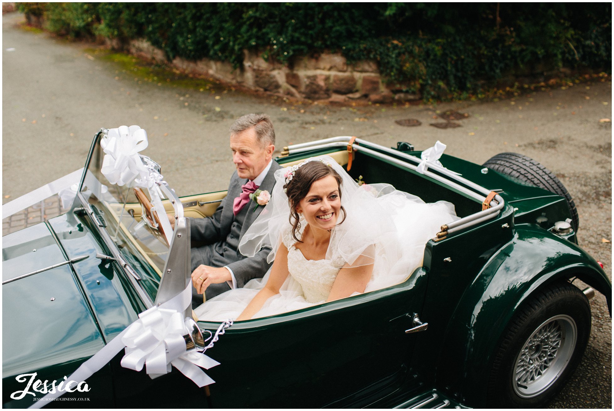 bride in her wedding car arriving at farndon church in chester
