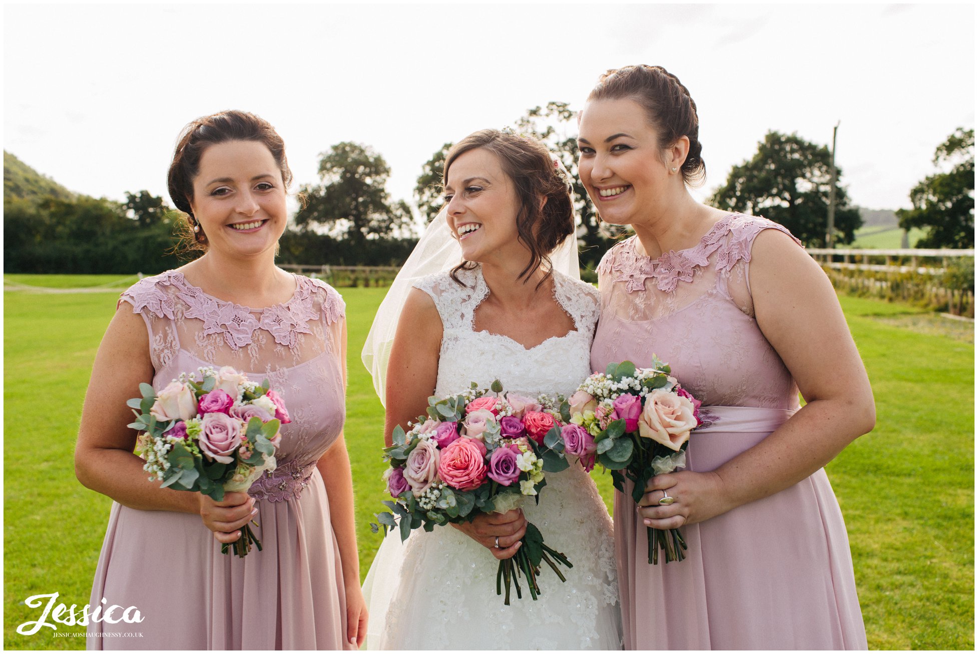 bride & her bridesmaids pose for a photograph at harthill weddings
