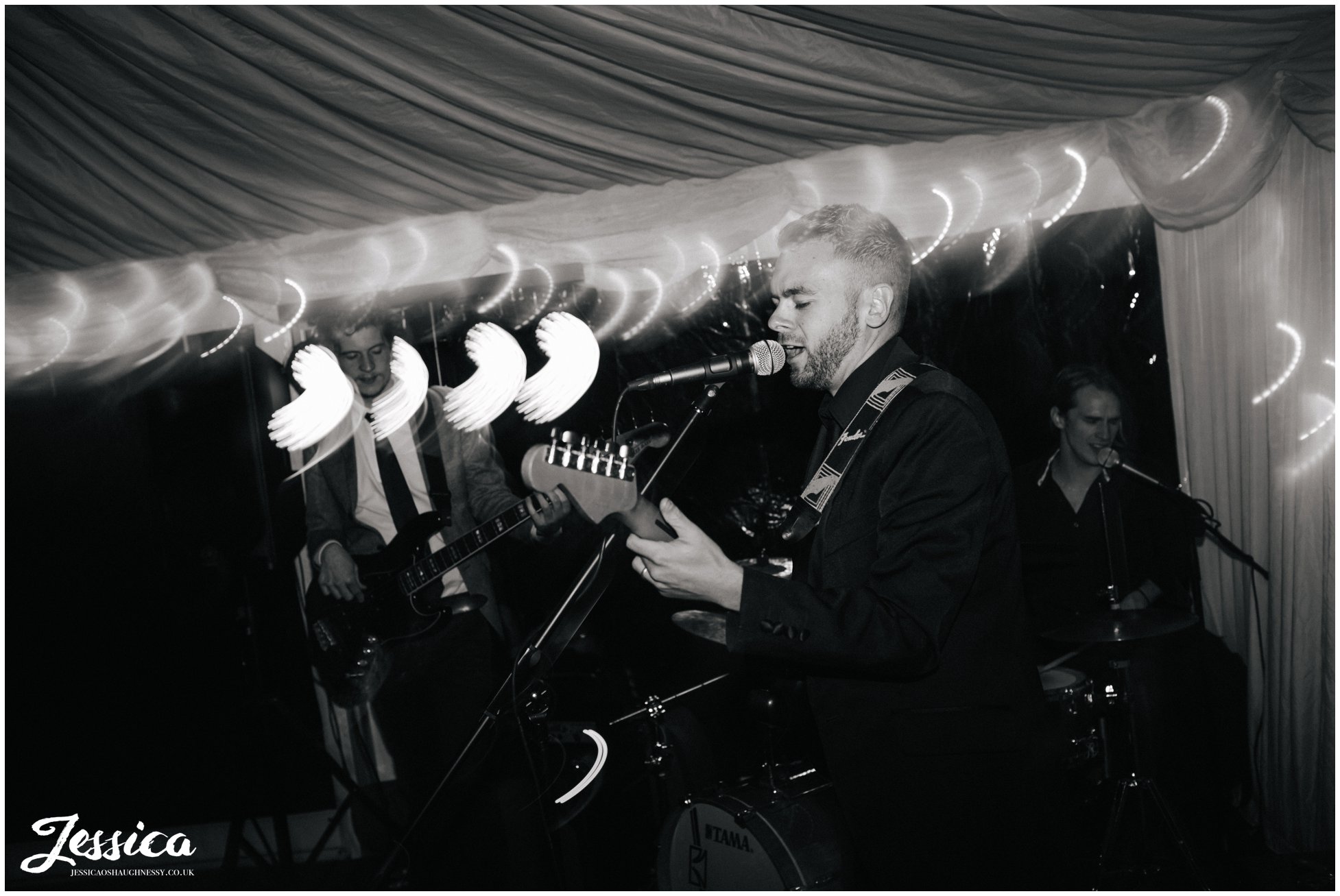 black and white band preforming during wedding reception at the success factory, cheshire