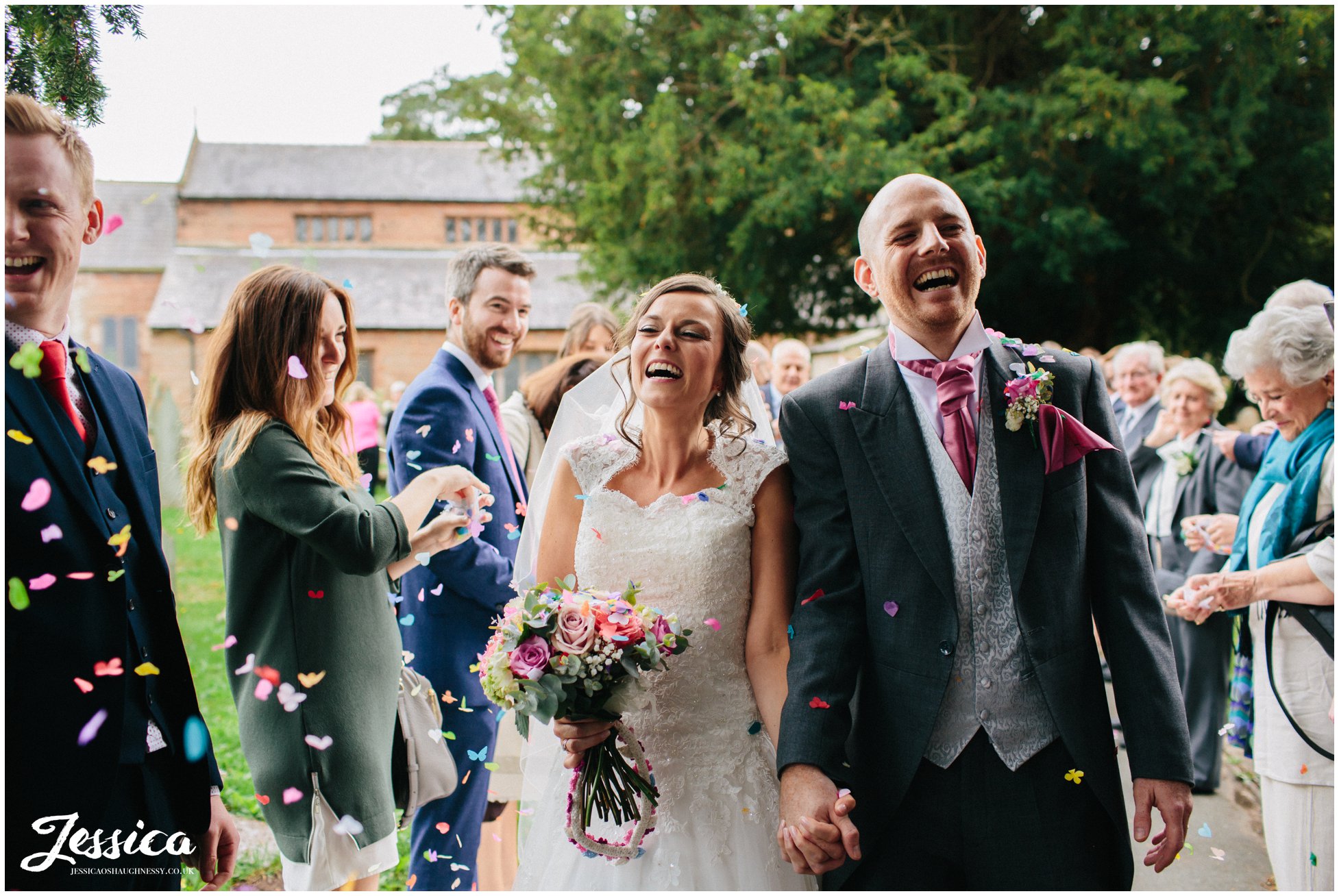 confetti thrown at bride & groom on their wedding day