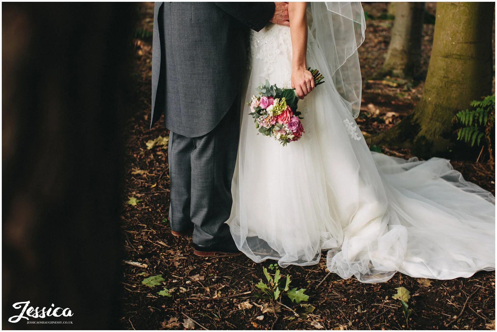bride holding her bouquet at her wedding at harthill weddings, the success factory