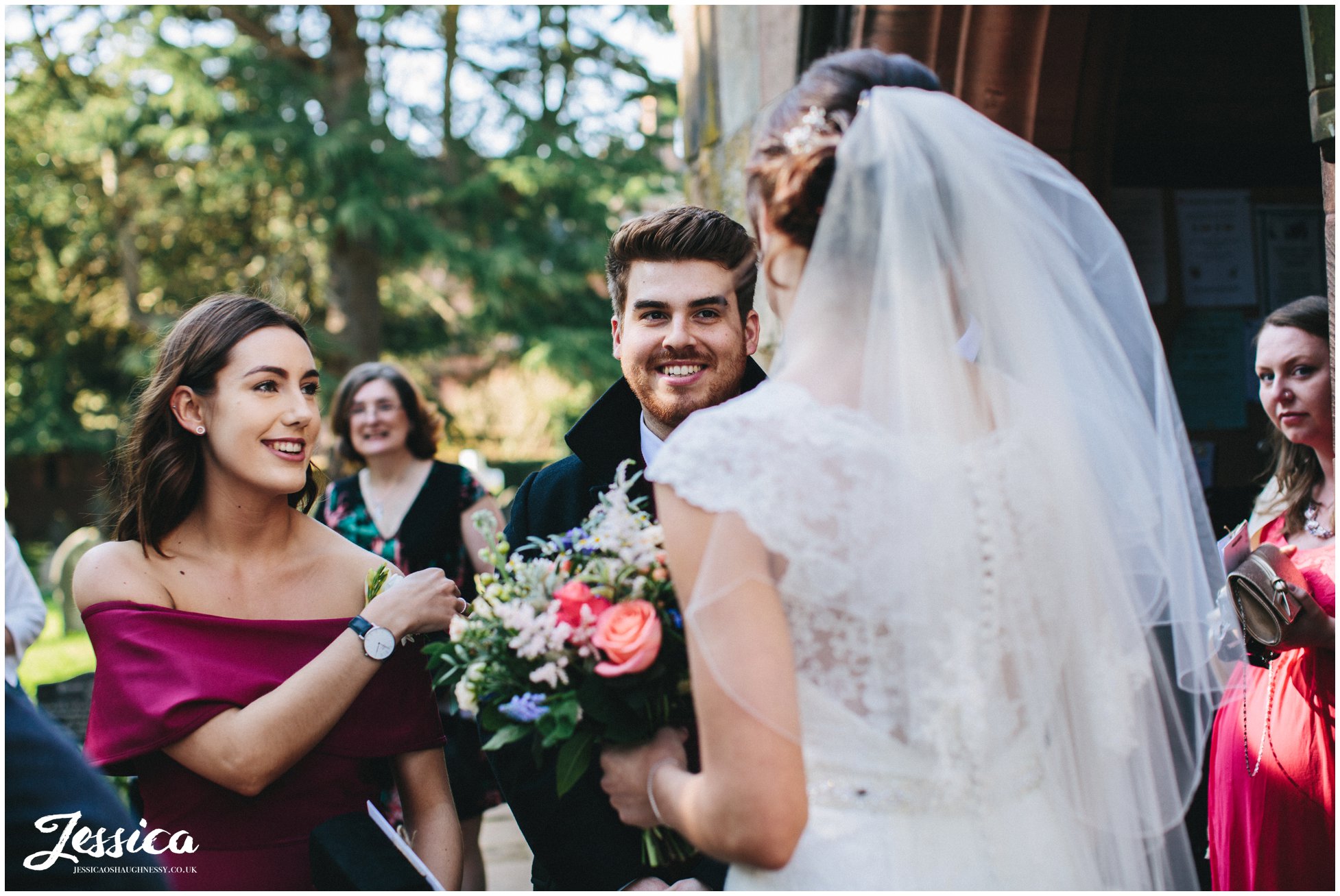 guests congratulate the bride after the wedding ceremony in north wales