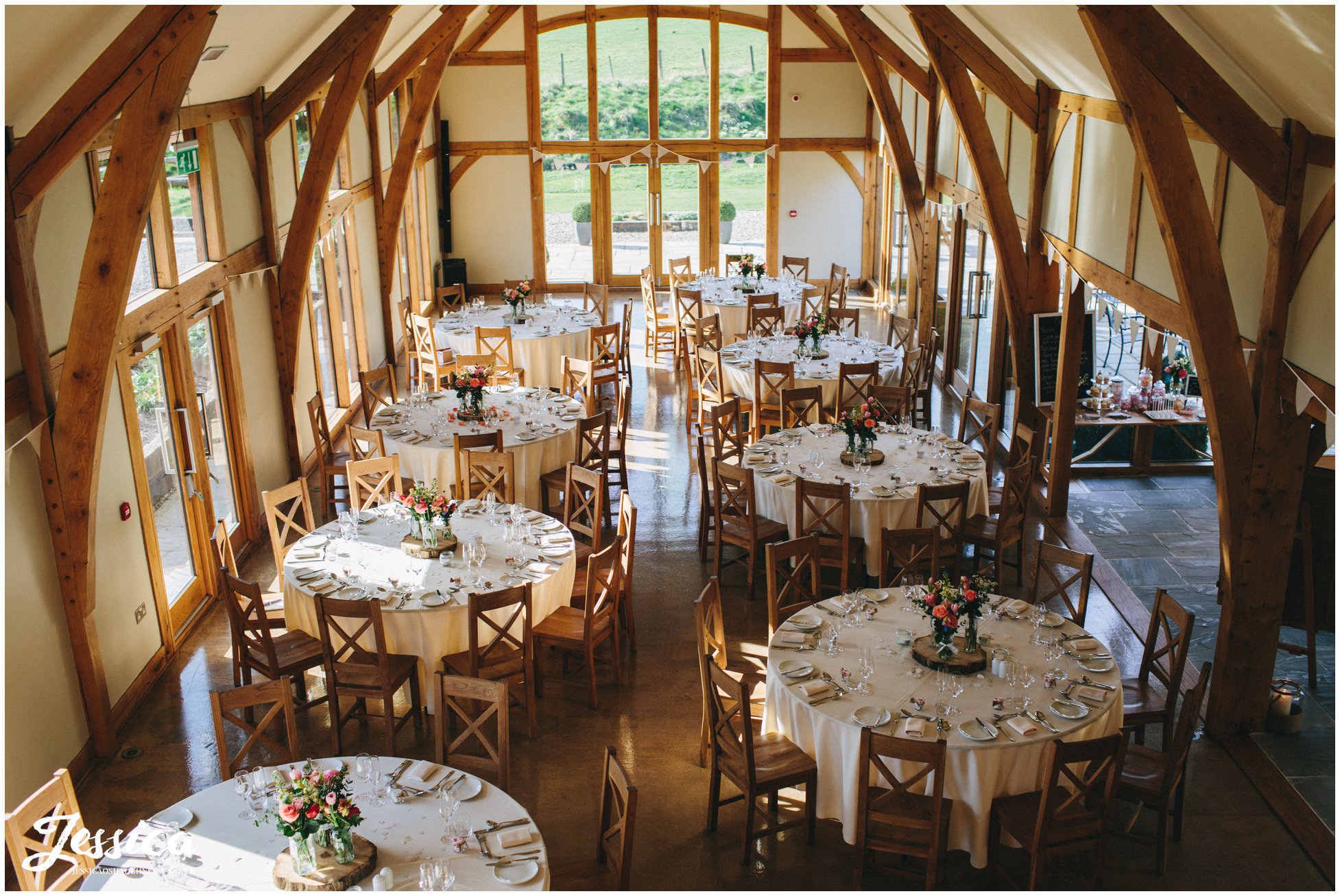 aerial shot of the tower hill barns room laid up for wedding breakfast