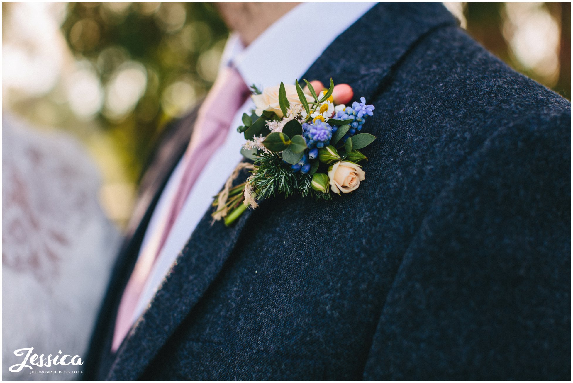 close up of the grooms rustic button hole