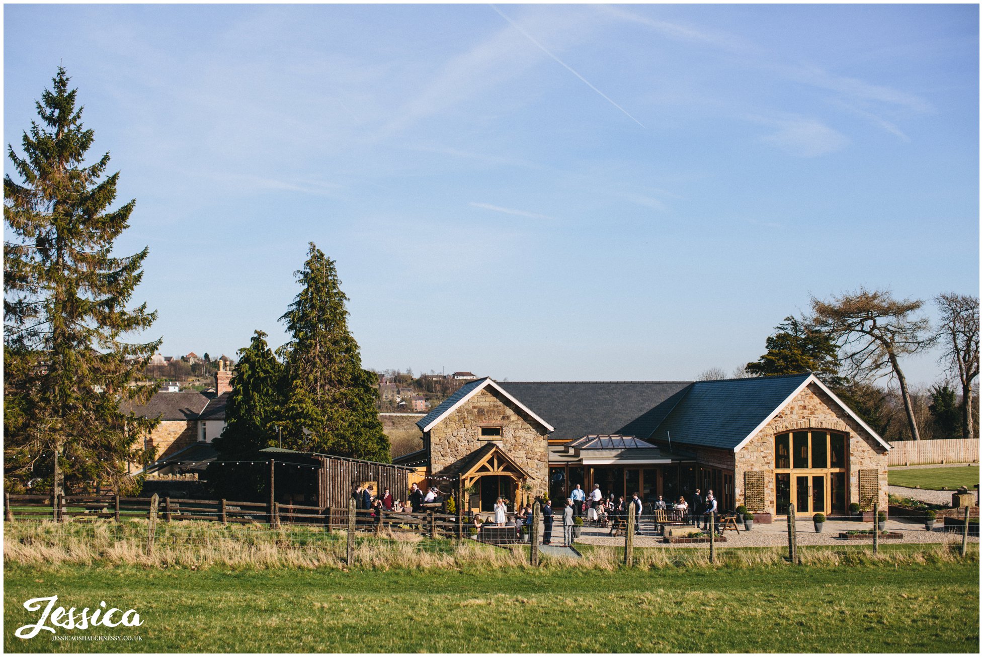 a view of tower hill barns at a sunny north wales wedding